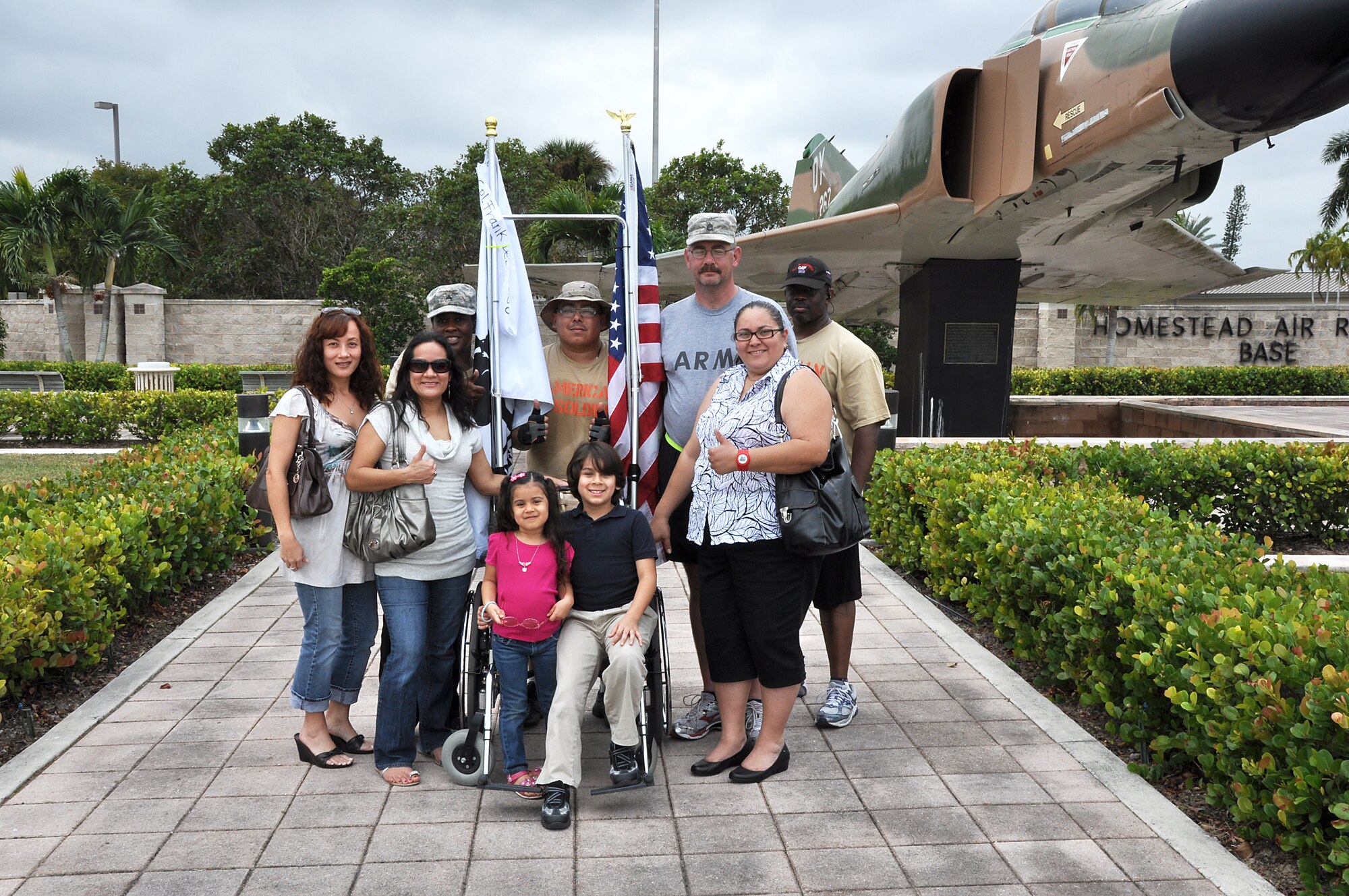 Four Army veterans who walked 101 miles to Homestead Air Reserve Base meet up with their family members after the four day journey.  From left to right  is Staff Sgt. Katrina Taylor, Sgt. Larry Maroto, Staff Sgt. Lewis West, and Staff Sgt. Stephen Murphy. (U.S. Air Force photo by Staff Sgt. Lou Burton, 482nd Fighter Wing Public Affairs)