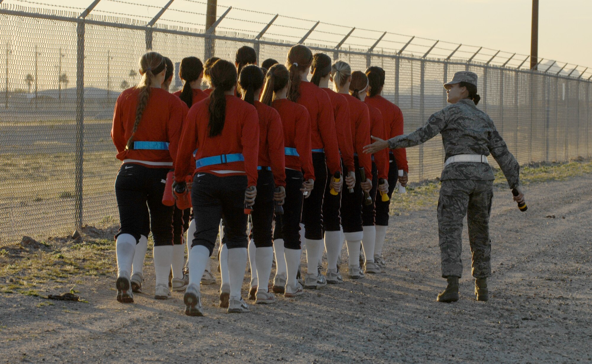 U.S. Air Force Tech. Sgt. Carrie Nunez, former military training instructor, teaches the University of Arizona softball team how to march on Davis-Monthan Air Force Base, Ariz., Jan. 13, 2012. The softball team had just finished running through the obstacle course. (U.S. Air Force photo by Airman 1st Class Josh Slavin/Released)