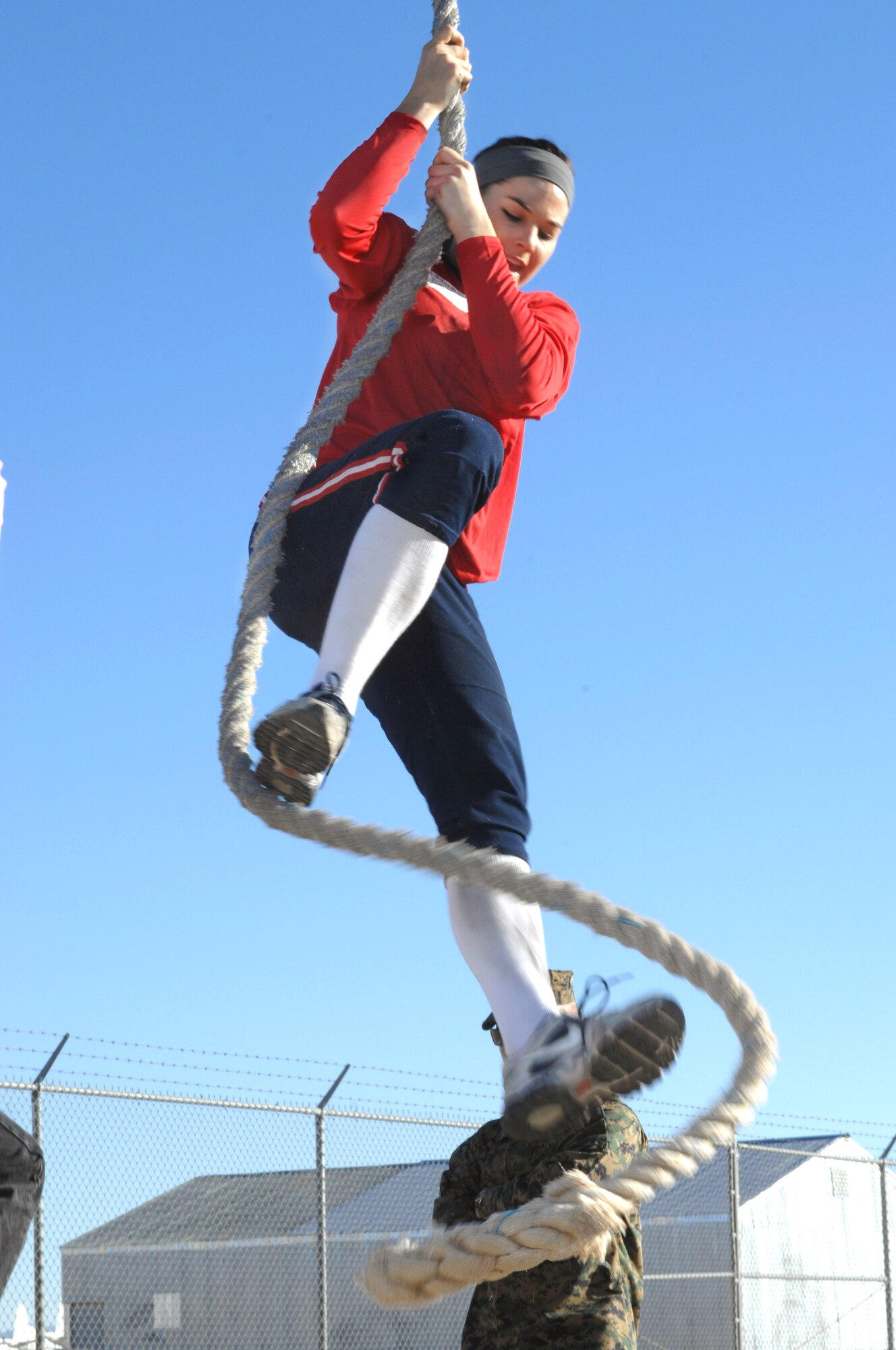 University of Arizona Student Samantha Lee Davis, women’s softball team third baseman, attempts to climb a rope while at an obstacle course on Davis-Monthan Air Force Base, Ariz., Jan. 13, 2012. The rope climb is the final obstacle on the course. (U.S. Air Force photo by Airman 1st Class Josh Slavin/Released)
