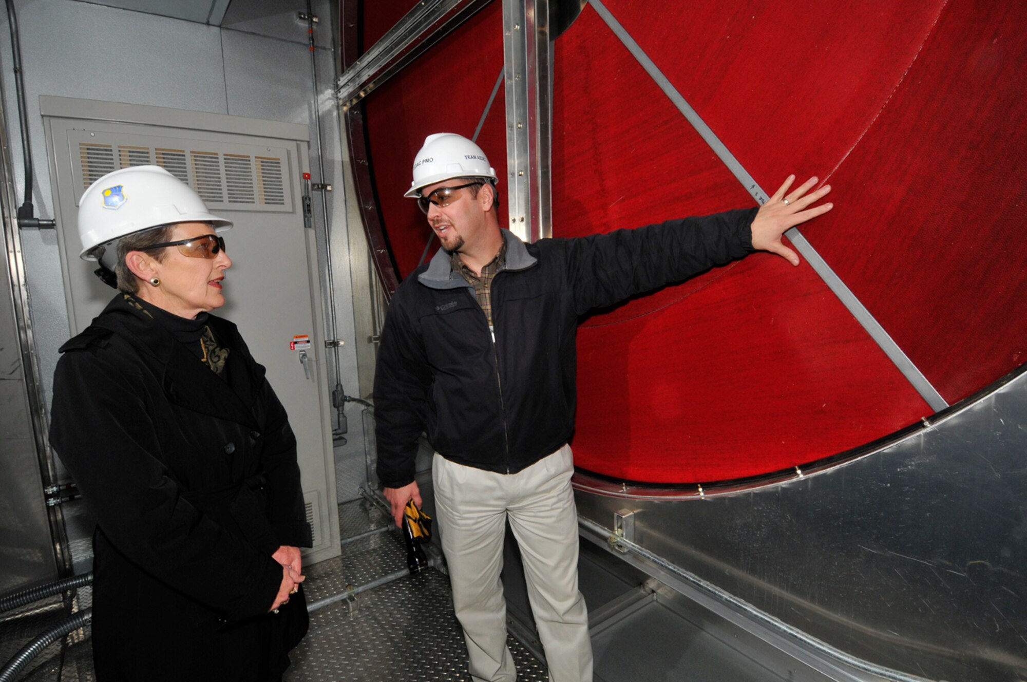 From right, Kris Hughes, project engineer with AEDC’s Test Systems Division/Investment Branch, briefs Peggy Gray on the desiccant dryer system for the Engine Test Facility during the ongoing Turbine-Engine Dry Air Capability (TEDAC) project on base. Gray, who is AEDC’s deputy director of financial management and comptroller, will retire at the end of the month. She said over the years she has made a concerted effort to keep up with AEDC’s testing facilities and infrastructure to understand how the taxpayer’s money is used and to advocate for future funding. (Photo by Rick Goodfriend)