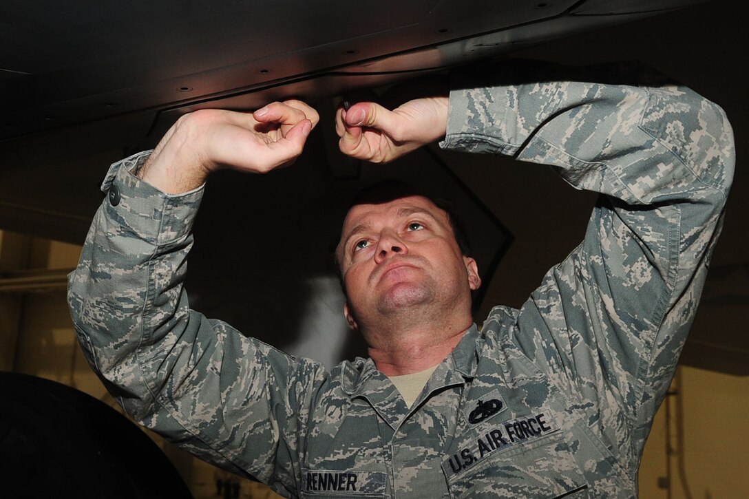 U.S. Air Force Tech. Sgt. Scott Brenner, 1st Maintenance Group package maintenance plan dock chief, checks the oil filter of an F-22 Raptor at Langley Air Force Base, Va., Jan. 12, 2012. The 1st MXG, along with the 192nd Maintenance Group, achieved the wing's highest F-22 mission capable rate since the jets began arriving at Langley AFB in 2005. (U.S. Air Force photo by Staff Sgt. Ashley Hawkins/Released)