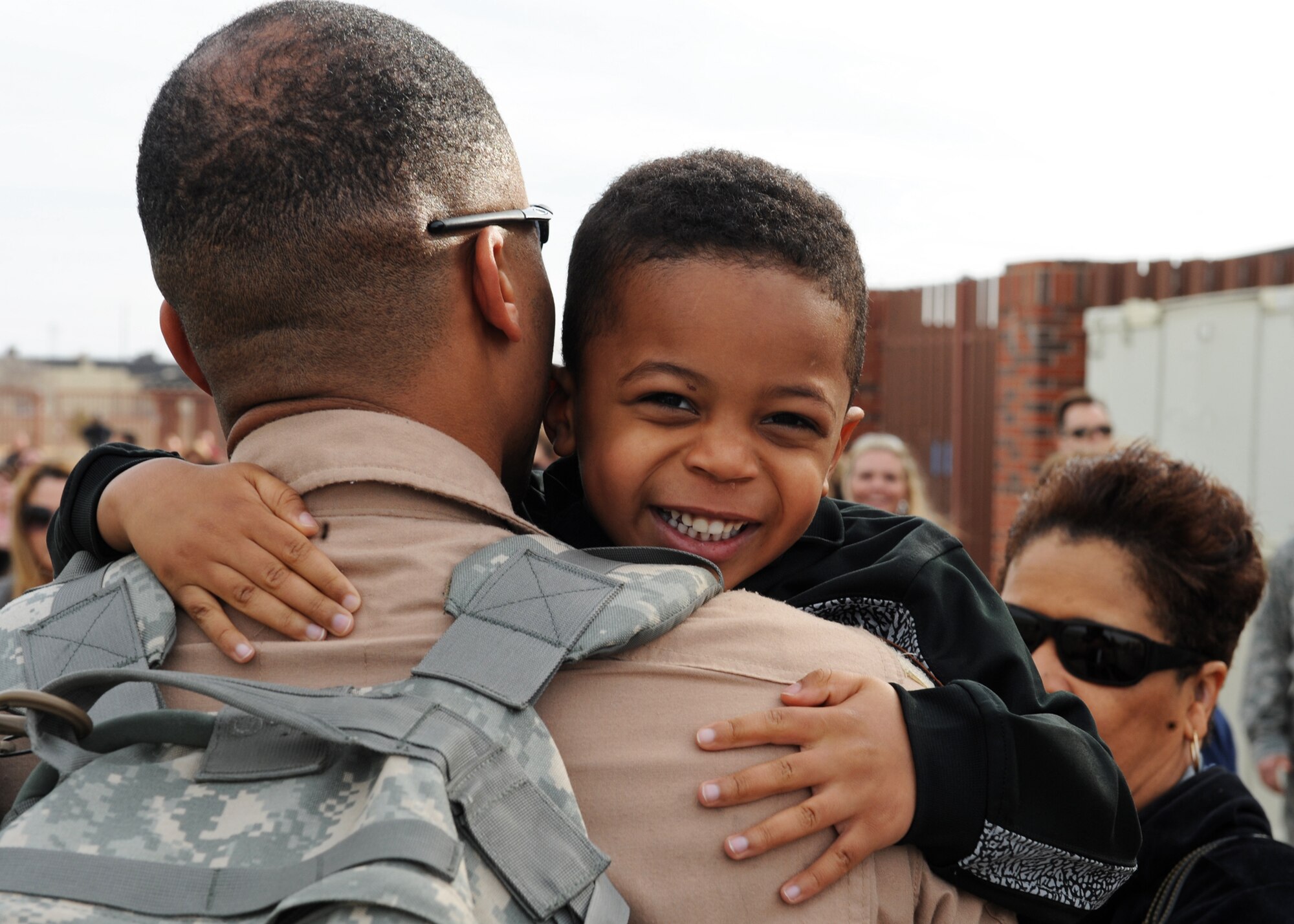 Tech. Sgt. Robert Furbush, 39th Airlift Squadron, embraces his son, Robert Furbush, Jr., Jan. 16, 2012, after returning to Dyess Air Force Base, Texas. Furbush returned from a 4-month deployment to Southwest Asia.  (U.S. Air Force photo Airman 1st Class Peter Thompson/Released)