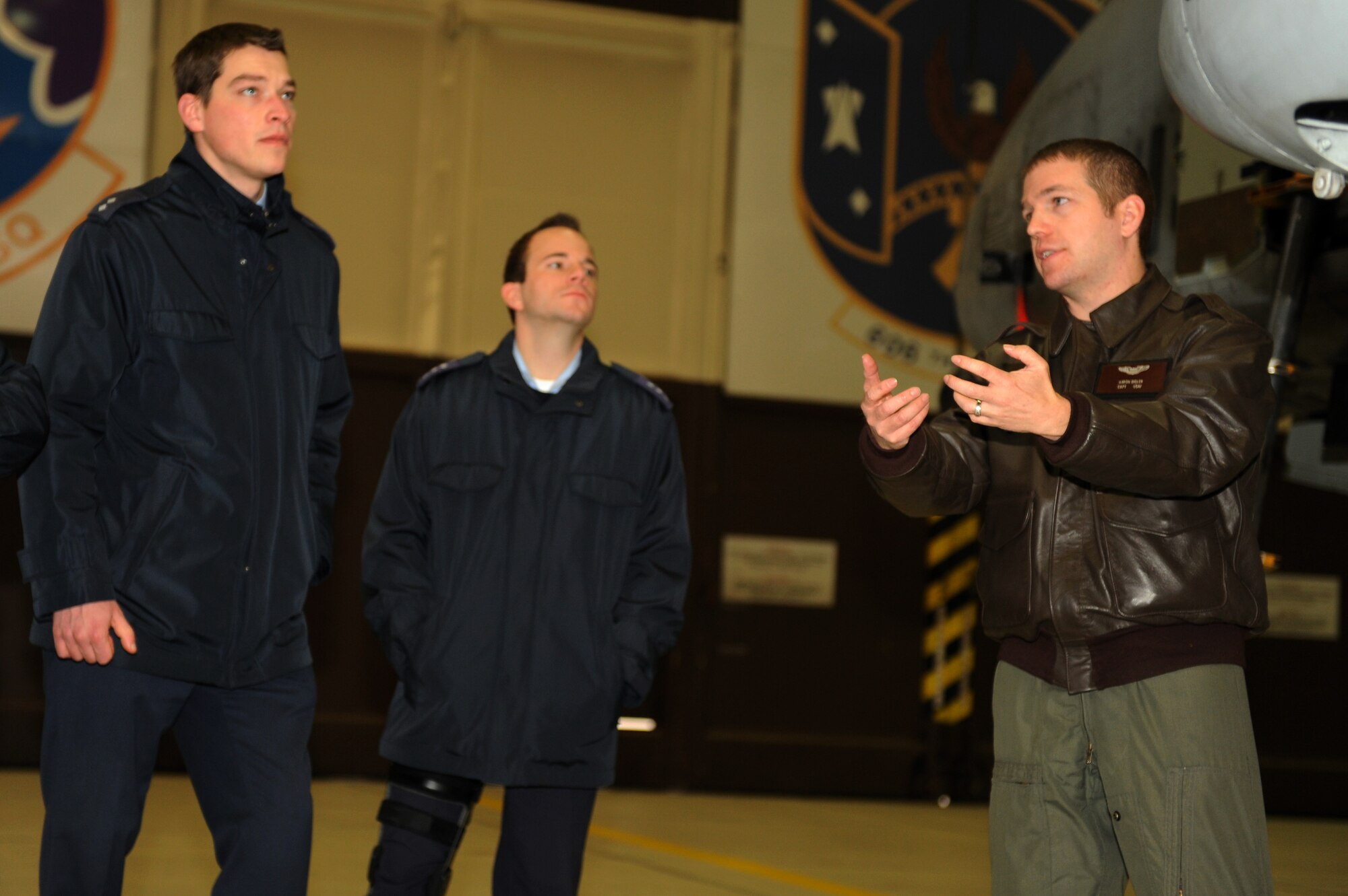 SPANGDAHLEM AIR BASE, Germany – U.S. Air Force Capt. Aaron Bigler, right, 81st Fighter Squadron A-10 Thunderbolt II pilot, talks with German air force members from the 10th Advance Air Mission Control Course in Erndtebrueck Bundeswehr about the capabilities of the F-16 Fighting Falcon. Students from the 10th AAMC visited Spangdahlem AB to gain a better understanding of the operations and capabilities of the 606th Air Control Squadron and the 52nd Fighter Wing’s fighter squadrons. (U.S. Air Force photo/Airman 1st Class Matthew B. Fredericks)