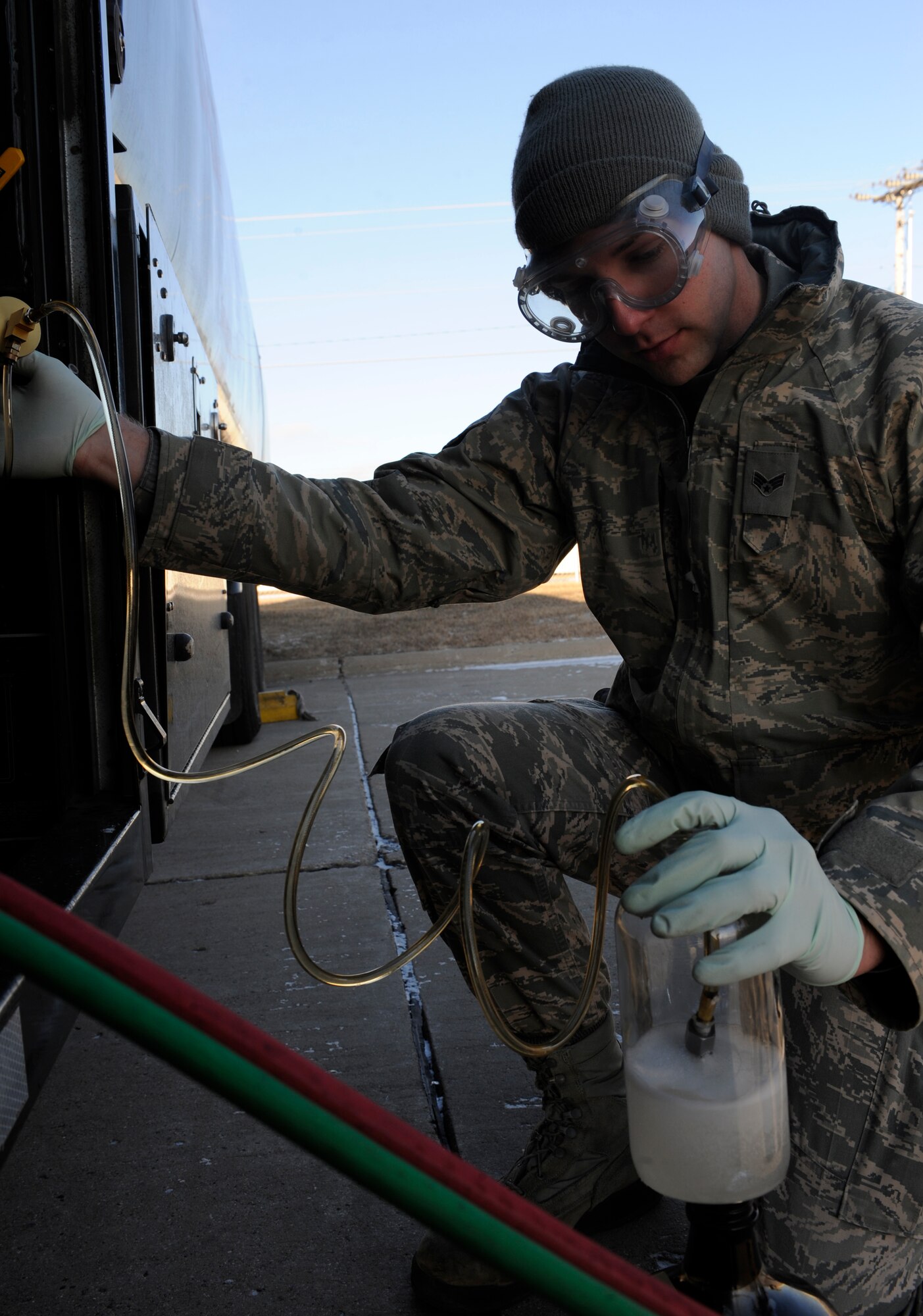 MINOT AIR FORCE BASE, N.D. -- Senior Airman David Peterson, 5th Logistics Readiness Squadron fuels laboratory technician, conducts a fuel analysis here Jan. 17. The analysis is done to identify any foreign contaminates or particles within the fuel, helping to ensure they can be removed and that no damage is caused to the equipment. Peterson was recently the recipient of the Fuels Airman of the Year award, a command-level recognition. (U.S. Air Force photo/Airman 1st Class Stephanie Ashley)