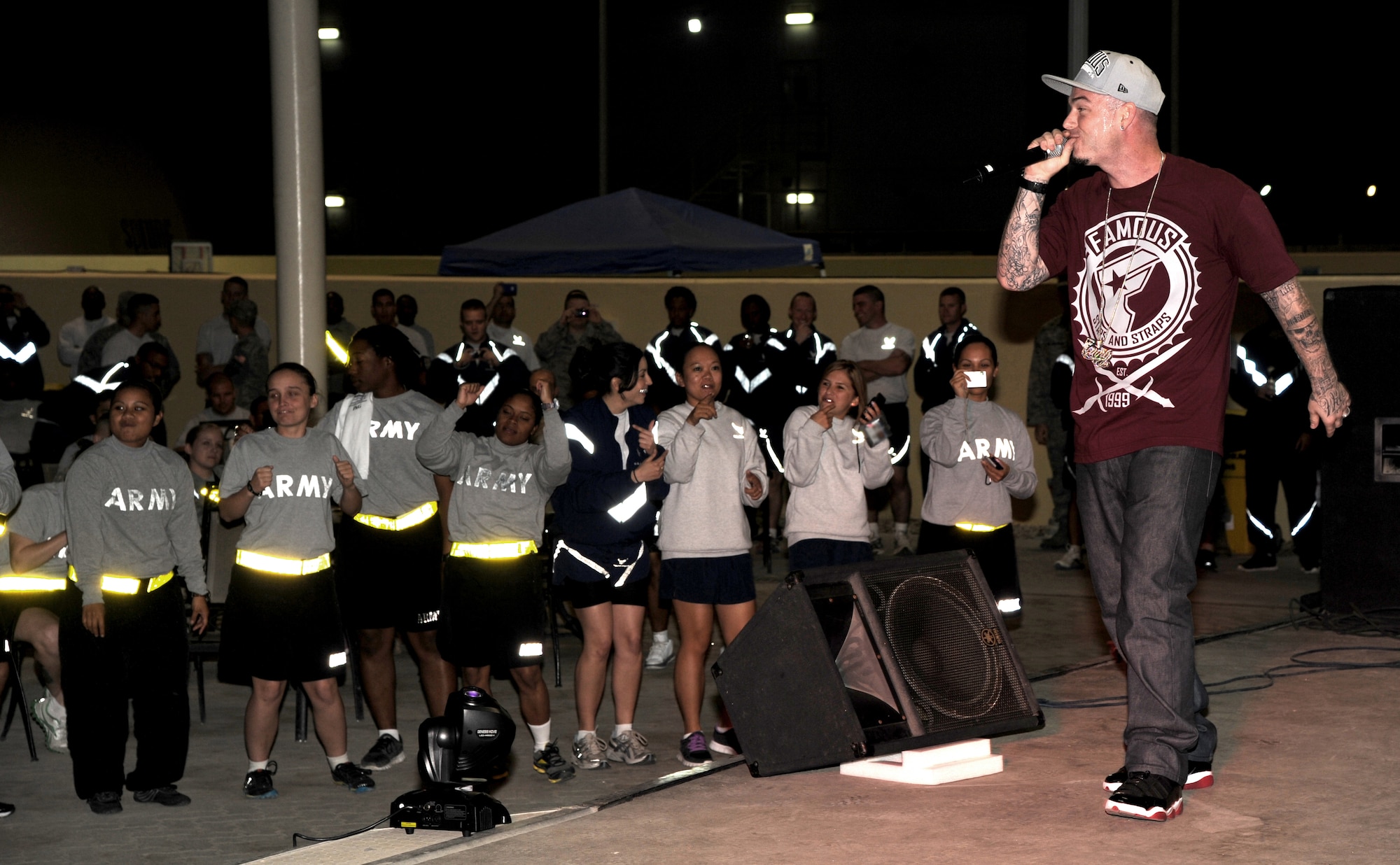 SOUTHWEST ASIA - Rap artist Paul Wall entertains troops from the 380th Air Expeditionary Wing at the Chapman Activity Center Pavilion Jan. 18, 2012.  This was the fifth USO tour for the performer,  but his first to the 380th AEW. (U.S. Air Force photo/Tech. Sgt. Arian Nead)