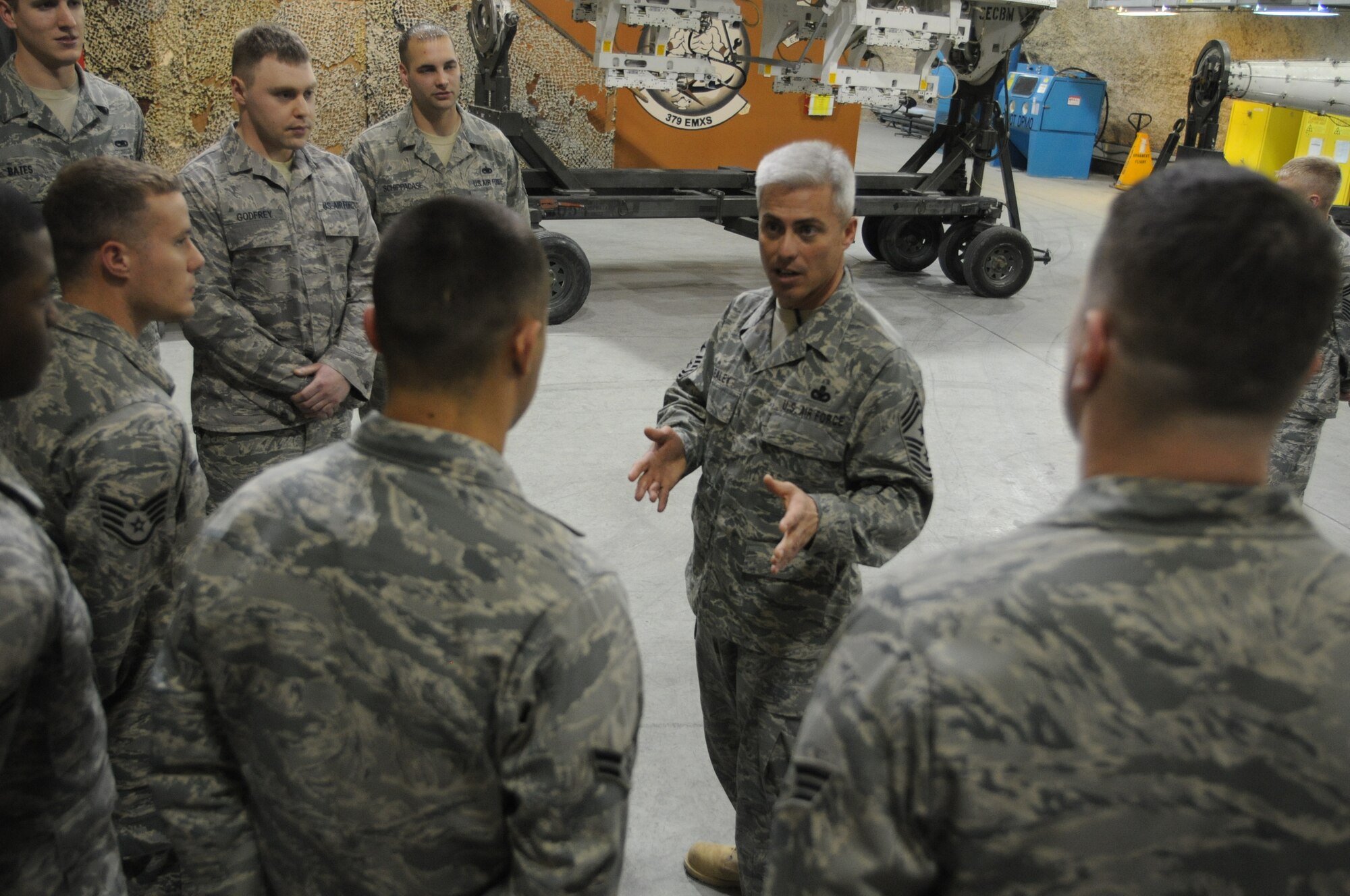 Chief Master Sgt. Robert Sealey, U.S. Air Forces Central command chief, answers questions from Airmen of the 379th Expeditionary Maintenance Squadron Jan. 18, 2012.  Sealey visited Airmen at several units here to share experiences and to answer questions about current issues. (U.S. Air Force photo/Master Sgt. Victoria Meyer)