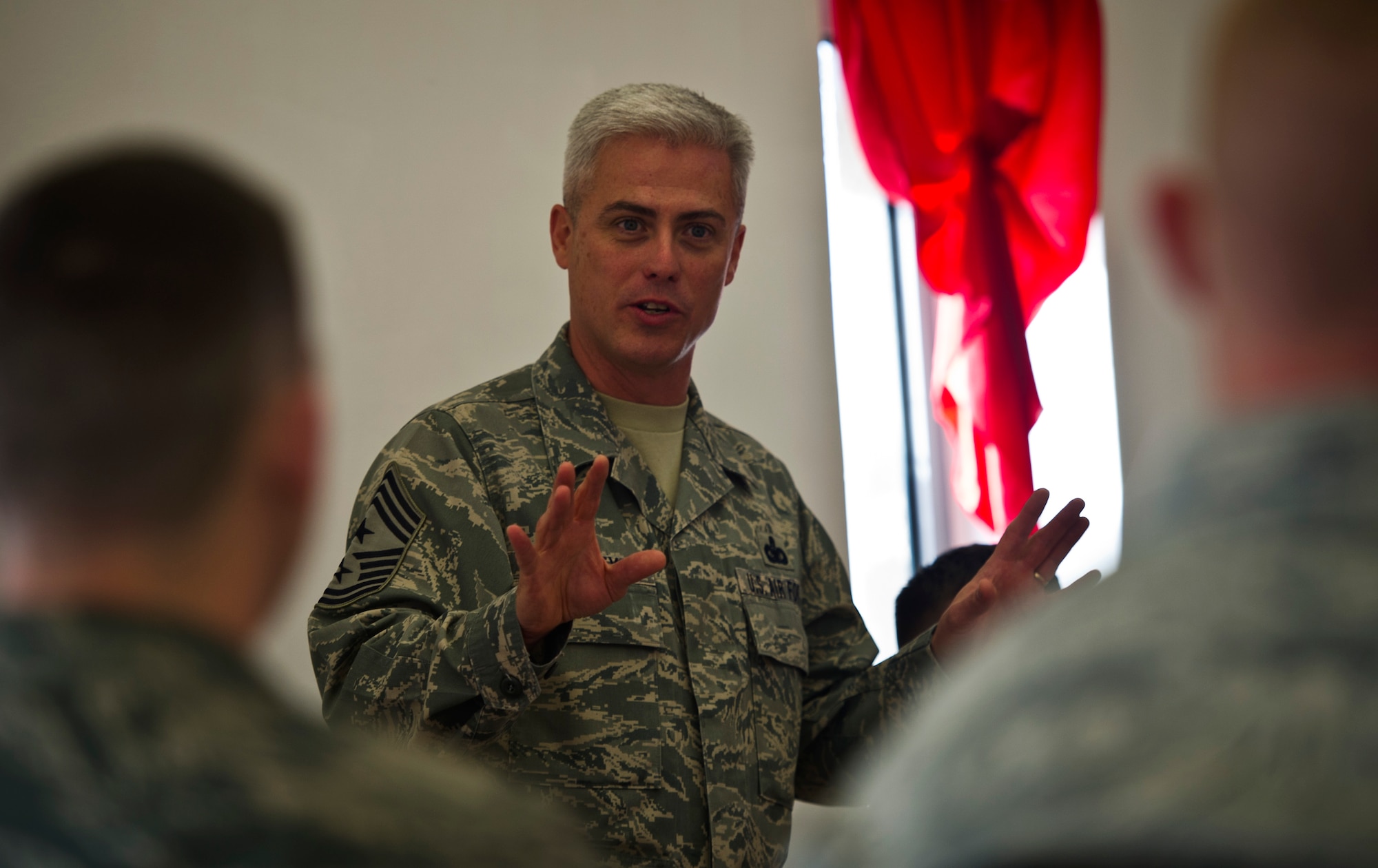 Chief Master Sgt. Robert Sealey, U.S. Air Forces Central command chief, speaks to Airmen from the 379th Air Expeditionary Wing here Jan. 18, 2012. Sealey visited Airmen at several units to share experiences and to answer questions about current issues. (U.S. Air Force photo/Staff Sgt. David Salanitri)