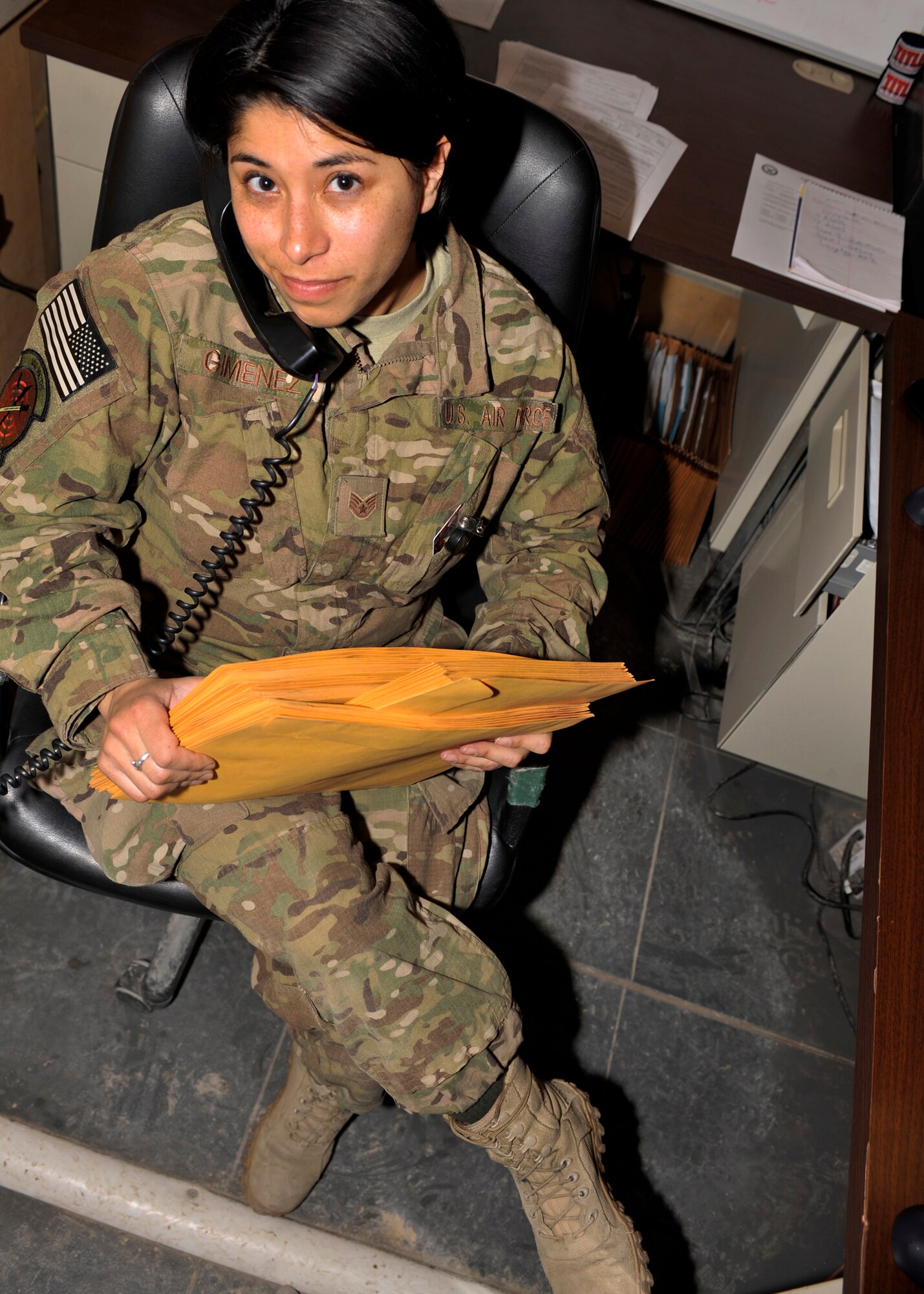 BAGRAM AIRFIELD, Afghanistan--  Staff Sgt. Angie Gimenez organizes awards paperwork at Bagram Airfield, Afghanistan, Jan. 19, 2012. Gimenez is the noncommissioned officer in charge of the Commander Support Section of the 817th Expeditionary Air Support Operations Squadron. She is deployed from Joint Base Lewis-McChord 1st  Air Support Operations Group and earned Warrior of the Week; an award designed to recognize superior Airmen’s hard work and commitment to excellence. (U.S. Air Force photo/ Airman 1st Class Ericka Engblom)