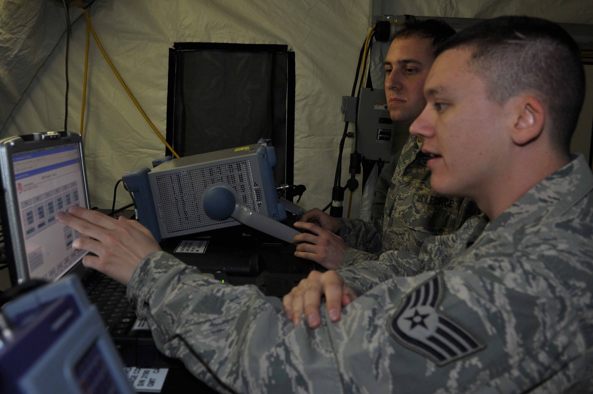 SPANGDAHLEM AIR BASE, Germany – Staff Sgt. Robert Land, 606th Air Control Squadron radio frequency transmitting systems carftsman, performs link management communication on a central control monitoring alarm terminal during a communications maintenance exercise here Jan. 18. Proper link management ensures a smooth transition off the satellite. The purpose of the exercise is to train squadron members in maintaining communication practices by establishing satellite communications and setting up a theater-deployable communications package. (U.S. Air Force photo/Senior Airman Natasha Stannard)