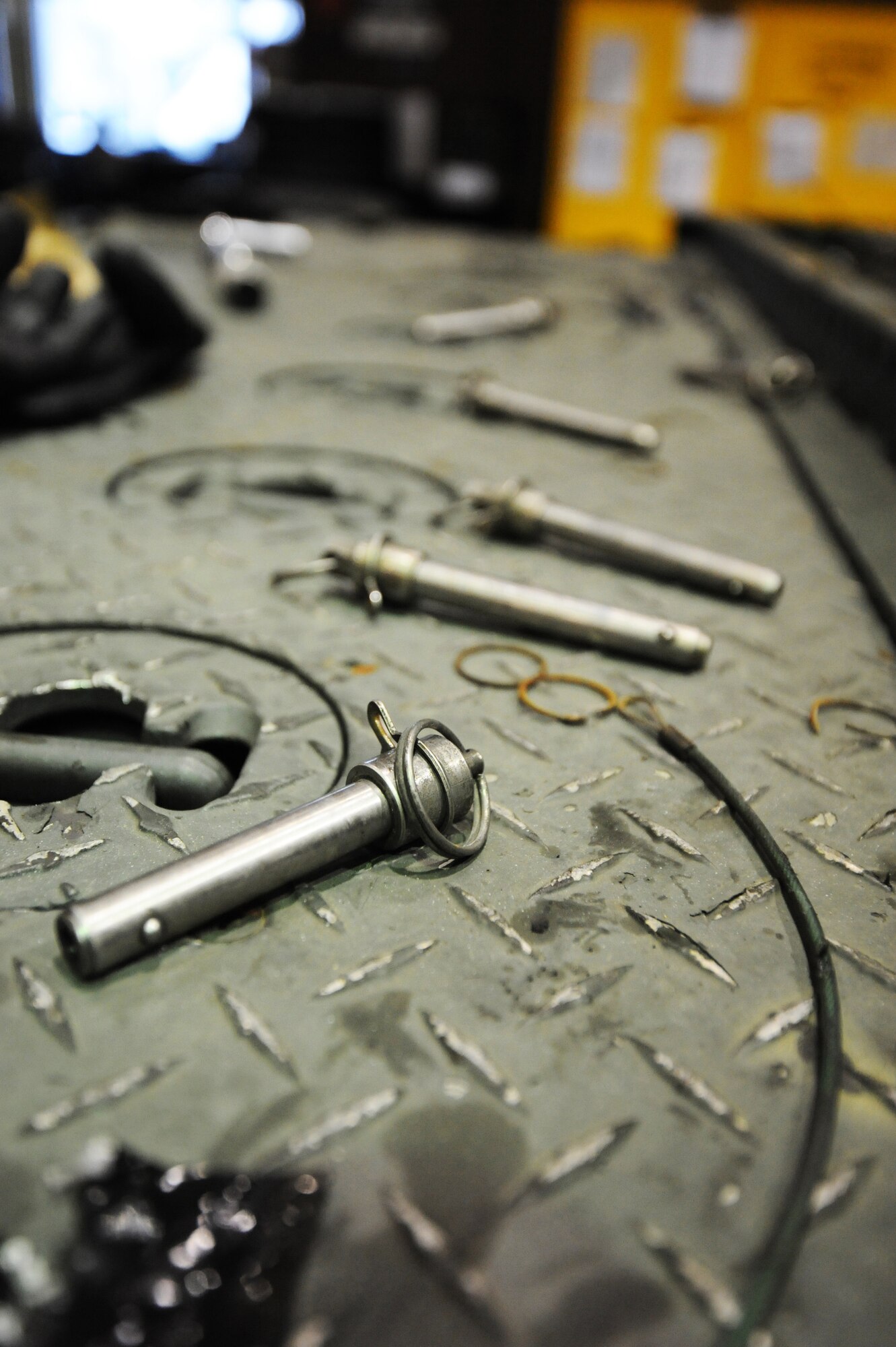 MISAWA AIR BASE, Japan -- Quick release pins, lanyards and other parts lay out on a Munitions Handling Unit 141 trailer that is due for a 720 day inspection here, Jan. 17. Without these pins, the MHU-141 trailer would not be able to fulfill its mission of storing and transporting munitions. (U.S. Air Force photo/Airman 1st Class Kia Atkins)
