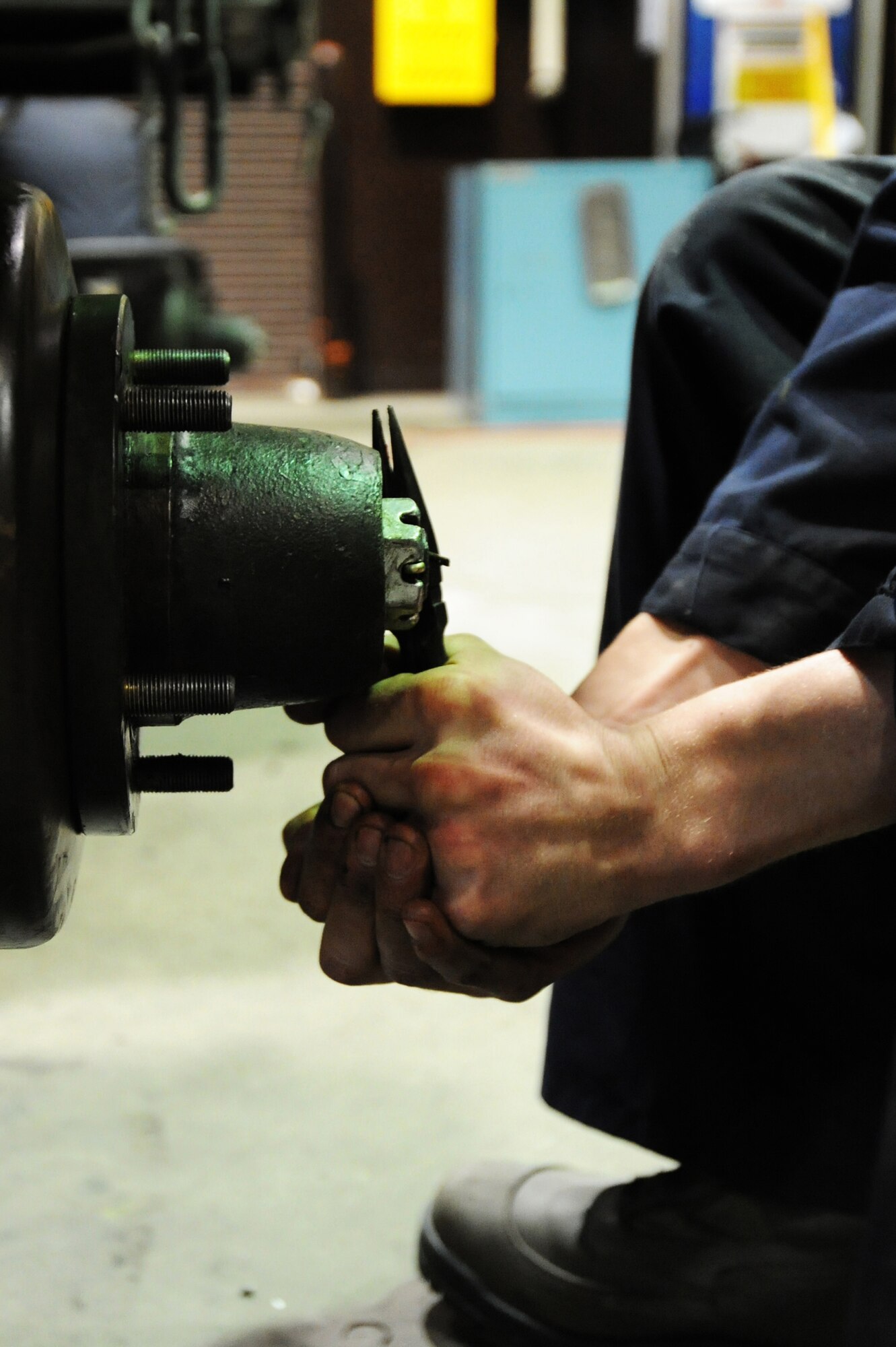 MISAWA AIR BASE, Japan -- Senior Airman Michael Grajek, 35th Maintenance Squadron munitions support equipment crew member, cuts the end of a cotter pin on a Munitions Handling Unit 141 trailer that is due for a 720 day inspection here, Jan. 17. At various times, all munitions items need to be inspected for safety and compliance with technical instructions. The MHU-141 trailer is designed for temporary storage and transportation of a variety of munitions. (U.S. Air Force photo/Airman 1st Class Kia Atkins)