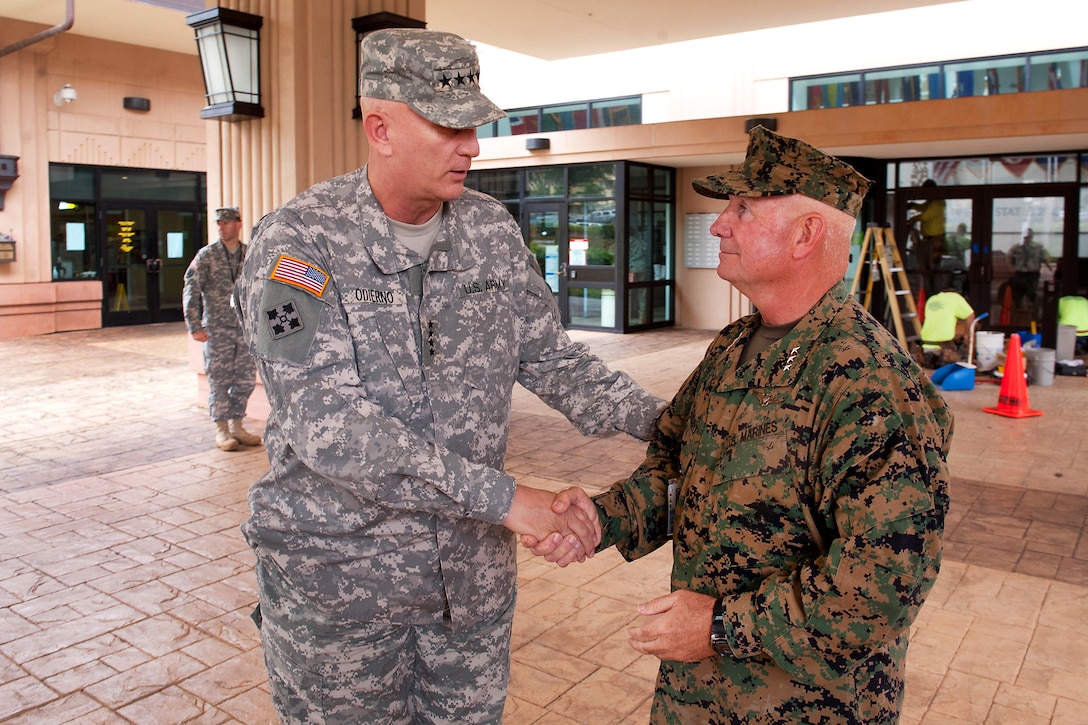 Army Chief of Staff Gen. Raymond T. Odierno shakes hands with Marine Corps Lt. Gen. Thomas Conant, deputy commander, U.S. Pacific Command, after a meeting at the U.S. Pacific Command Headquarters on Camp H.M. Smith, Hawaii, Jan. 17, 2012.