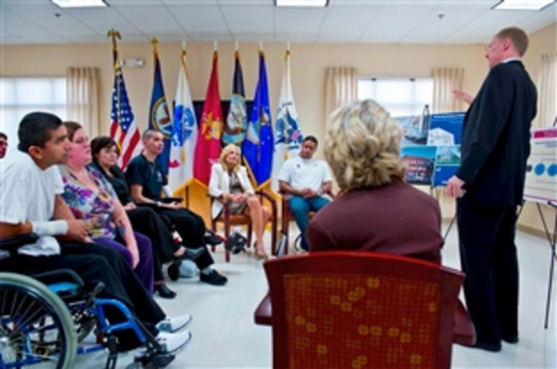 Jill Biden, center back, wife of Vice President Joe Biden, meets with wounded warriors, their families, and staff members at the Palo Alto Polytrauma Rehabilitation Center, a part of  the Department of Veterans Affairs, in Palo Alto, Calif., Jan. 18, 2012.