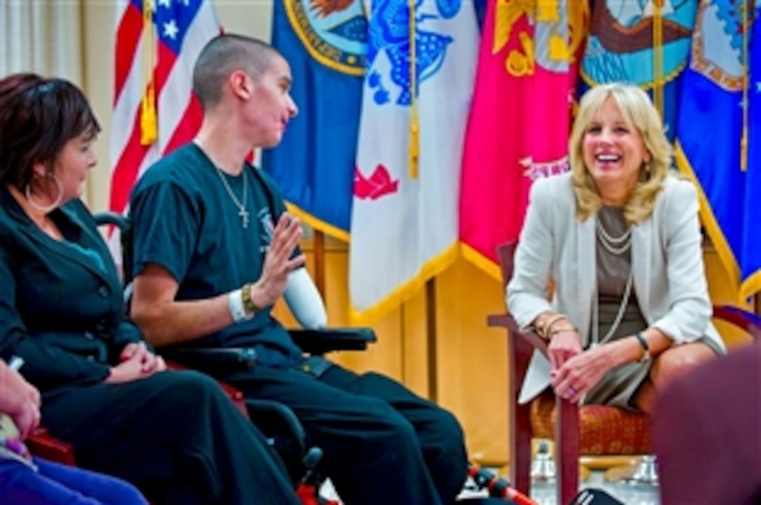 Jill Biden, wife of Vice President Joe Biden, interacts with Army Pfc. Geoffrey Quevedo and his mother, Ana, at the Palo Alto Polytrauma Rehabilitation Center, part of the Department of Veterans Affairs, in Palo Alto, Calif., Jan. 18, 2012.  Quevedo lost his left foot and part of his arm to a roadside bomb in Afghanistan in November. Biden's conversation with Quevedo was part of a larger meeting with wounded warriors, their families, and staff members.