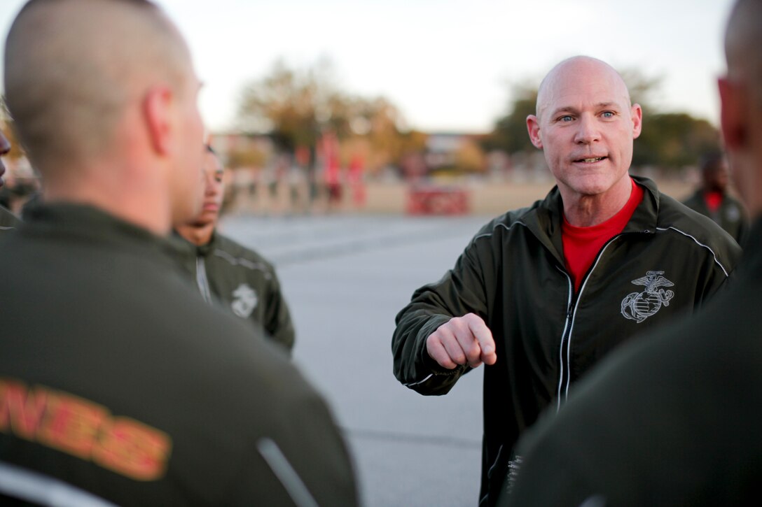 Sgt. Maj. Micheal P. Barrett, the 17th Sergeant Major of the Marine Corps, participates speaks to the honor graduates of Charlie Company, 1st Recruit Training Battalion, after a motivational run at Marine Corps Recruit Depot Parris Island, S.C., Jan. 19, 2012.