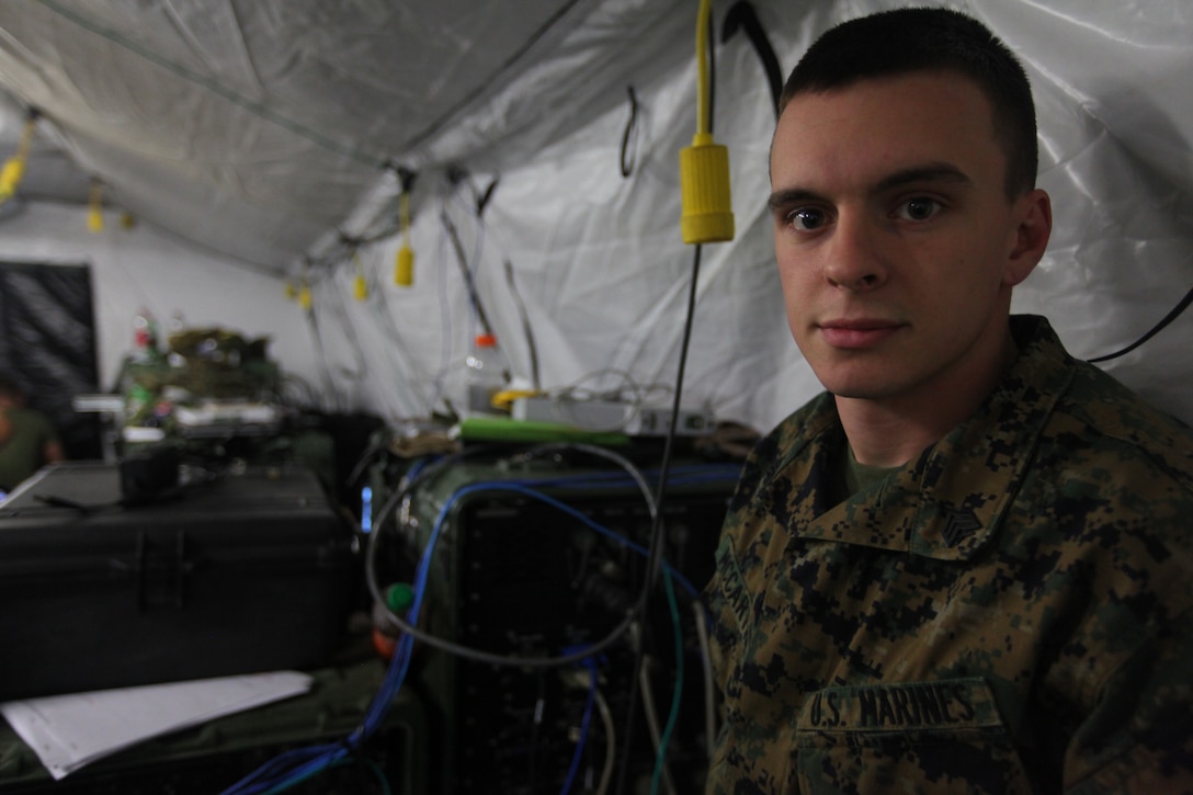 Sgt. Casey McCarthy, a data network specialist with the 24th Marine Expeditionary Unit’s Communications Section, poses by a wall of servers, here, Jan. 19, 2012. The Montgomery, Ala., native’s job in the Marine Corps centers on a gambit of computer-centric tasks such as: assembling servers, establishing and trouble shooting a tactical data network, uploading software and more. McCarthy helps maintain the 24th MEU’s data network system during the unit’s Realistic Urban Training (RUT) exercise scheduled Jan. 5-20. The exercise serves to prepare and certify the Marines and Sailors of the 24th MEU for the various operations they may conduct during their upcoming deployment.