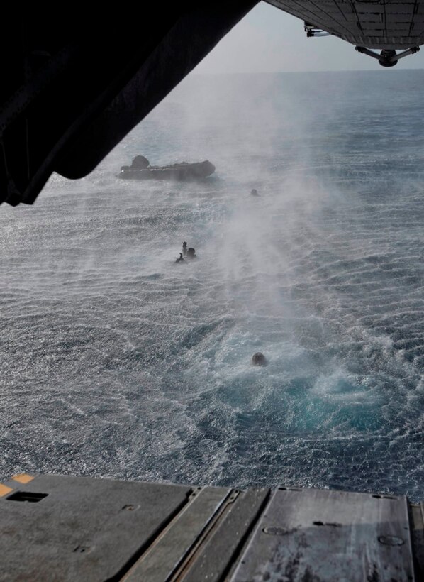 Reconnaissance Marines with Battalion Landing Team 3/1, 11th Marine Expeditionary Unit, swim towards a Rigid Hull Inflatable Boat (RHIB) Jan. 19 after jumping from a CH-53E Super Stallion. The helicopter is flown by pilots of Marine Medium Helicopter Squadron 268 (Reinforced), the aviation combat element for the unit. The expeditionary unit is currently deployed aboard the amphibious assault ship as part of the Makin Island Amphibious Ready Group, which is a U.S. Central Command theater reserve force. The group is also providing support for maritime security operations and theater security cooperation efforts in the U.S. Navy's 5th Fleet area of responsibility.