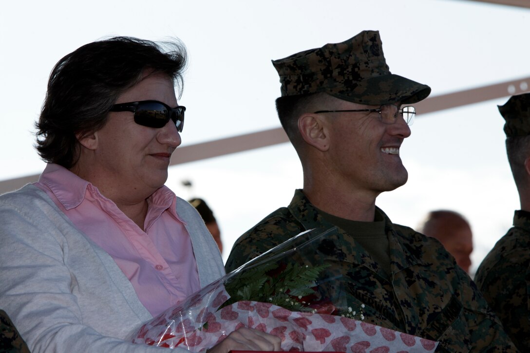 Sgt. Maj. Charles T. Blumenberg, the sergeant major of Combat Logistics Regiment 25, 2nd Marine Logistics Group, stands next to his wife, Kathy, while she received a certificate of appreciation during his retirement ceremony aboard Camp Lejeune, N.C., Jan. 20, 2012. Blumenberg retired after 31 years of service. (Photo by Cpl. Bruno J. Bego)