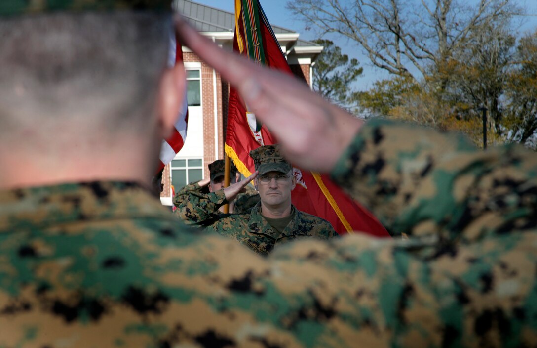 Sgt. Maj. Thomas E. Sherwood, former sergeant major of Headquarters and Headquarters Squadron of Marine Corps Air Station Cherry Point, salutes H&HS commanding officer, Lt. Col. Samuel P. Mowery, after passing his duties off to Sgt. Maj. Holly C. Prafke during a relief and appointment ceremony on the MCAS Cherry Point parade field Jan. 20, 2012. Sherwood is moving on to assume responsibility as sergeant major of Marine Aviation Logistics Squadron 29 of MCAS New River.  "This squadron has its DNA on just about everything that happens on this station," said Sherwood. "We run this base, as well as the air space."