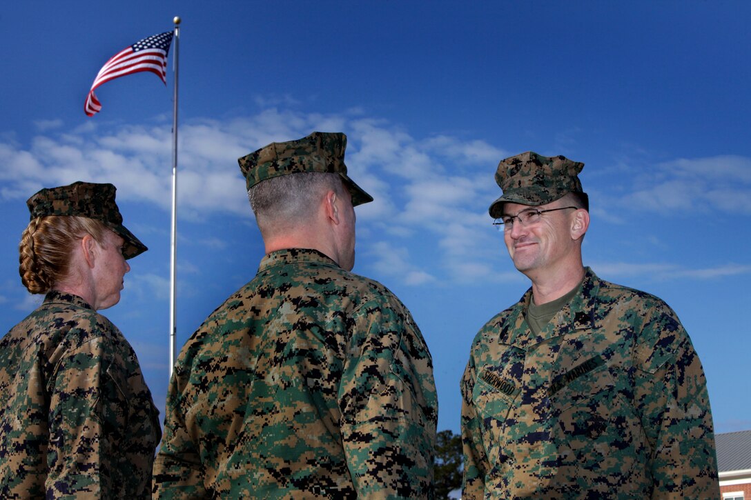 Sgt. Maj. Thomas E. Sherwood, former sergeant major of Headquarters and Headquarters Squadron of Marine Corps Air Station Cherry Point, stands before H&HS commanding officer, Lt. Col. Samuel P. Mowery, before being presented a distinguished service medal during the squadron's relief and appointment ceremony on the MCAS Cherry Point parade field Jan. 20, 2012. Sgt. Maj. Holly C. Prafke, formerly of Marine Tactical Electronic Warfare Squadron 3, was appointed as the new sergeant major of H&HS. "It's going to be fast paced but I'm ready to go," she said. "I'm ready to work for and serve the Marines of this squadron."