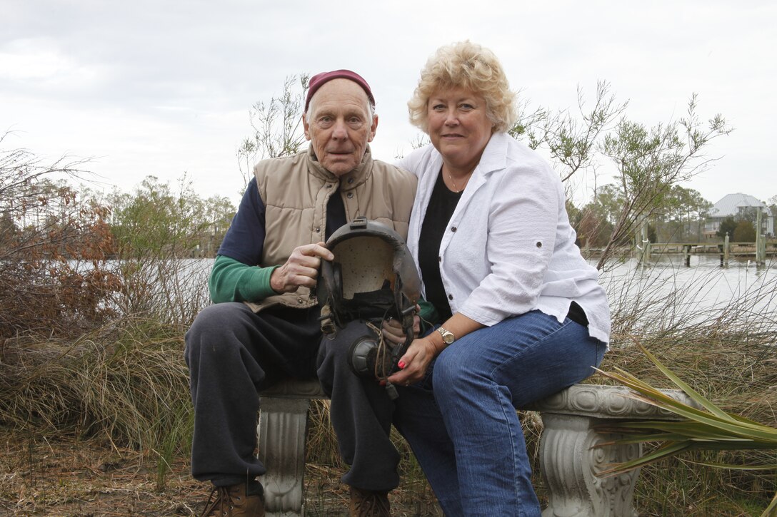 Pamlico County residents Bob and Beverly Fruhling sit on the banks of the Pamlico River near where former Cobra pilot Dennis DeRienzo's helmet was found. The couple thinks the helmet was wept up in the wake of Hurricane Irene in August 2011. The helmet was lost when th Cobra, co-piloted by DeRienzo, crashed during a routine pre-deployment exercise on February 10, 1999.