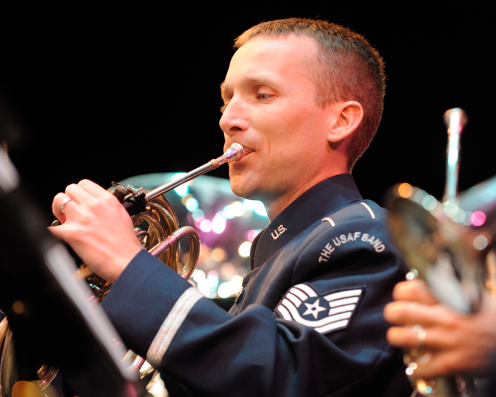 U.S. Air Force Tech. Sgt. Christopher Brown, a French hornist with the U.S. Air Force Band Ceremonial Brass and Columbus, Ga., native, performs during a concert in Palm Beach Gardens, Fla., Jan. 20, 2012.  The Ceremonial Brass is on their first American concert tour playing venues throughout Florida. U.S. Air Force photo by Master Sgt. Adam M. Stump/RELEASED.