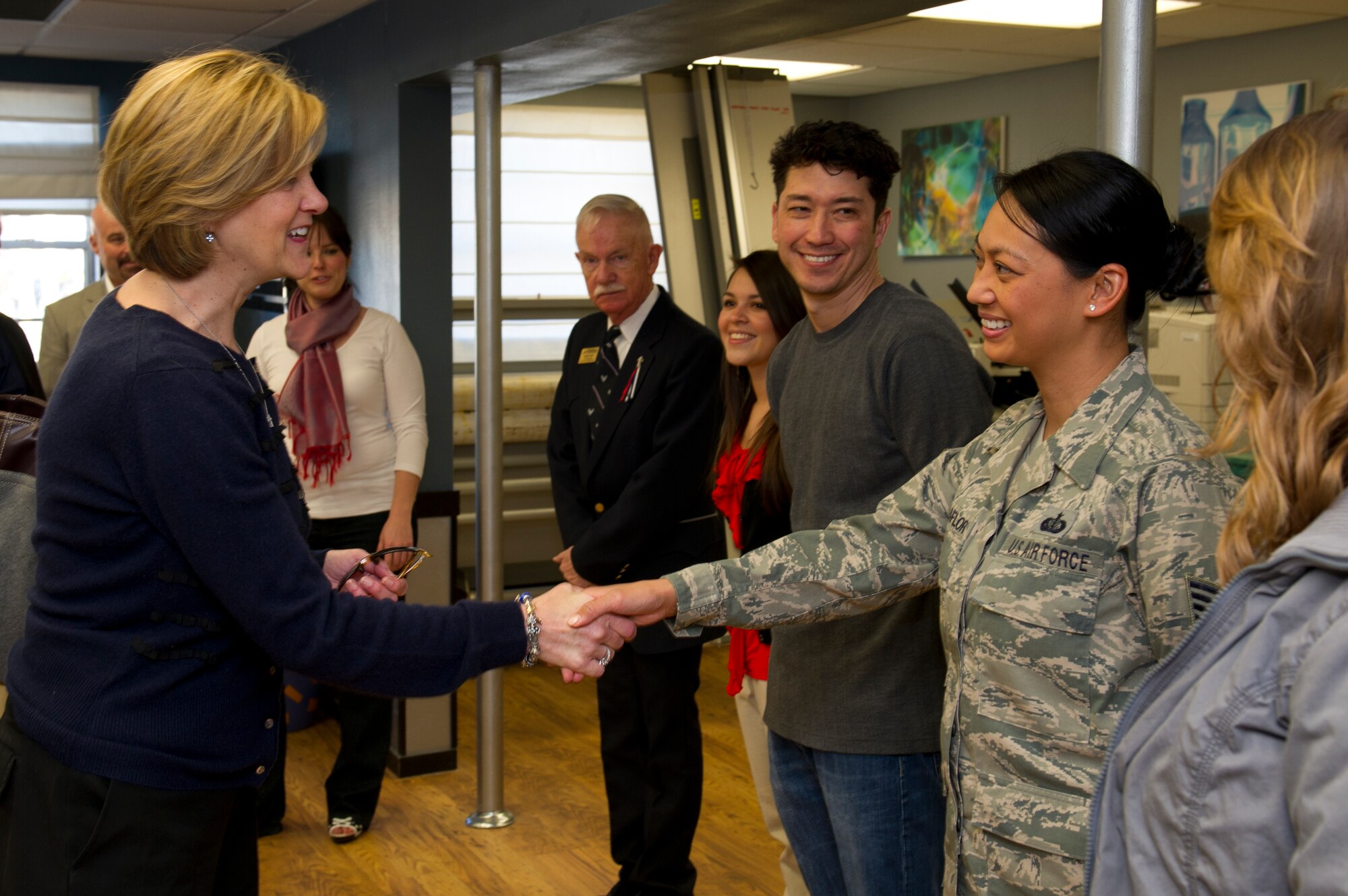 HOLLOMAN AIR FORCE BASE, N.M. -- Kim Rand, wife of U.S. Air Force Lt. Gen. Robin Rand, 12th Air Force commander, shakes hands with Tech. Sgt. Michelle Villaflor, 49th Force Support Squadron marketing assistant, Jan. 19, at the Marketing Office. Rand accompanied her husband on his first trip to Holloman and visited with different base agencies. (U.S. Air Force photo by Senior Airman Kasey Close/Released)