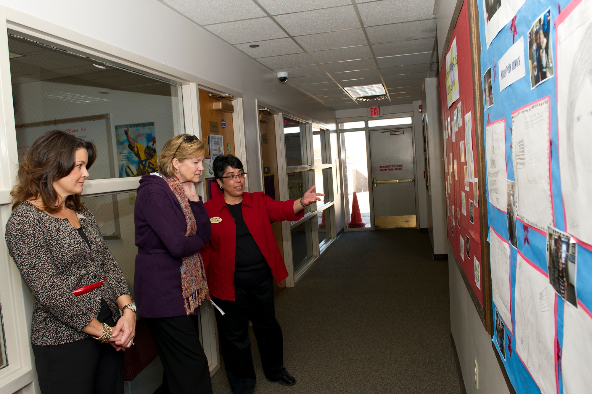 HOLLOMAN AIR FORCE BASE, N.M. -- Lisa Krumm, wife of U.S. Air Force Col. David Krumm, 49th Wing commander, and Kim Rand, wife of U.S. Air Force Lt. Gen. Robin Rand, 12th Air Force commander, listen to Genevieve Melon, Youth Center program director, Jan. 18 at the Youth and Teen Center. Rand accompanied her husband on his first trip to Holloman and visited with different base agencies. (U.S. Air Force photo by Senior Airman Kasey Close/Released)