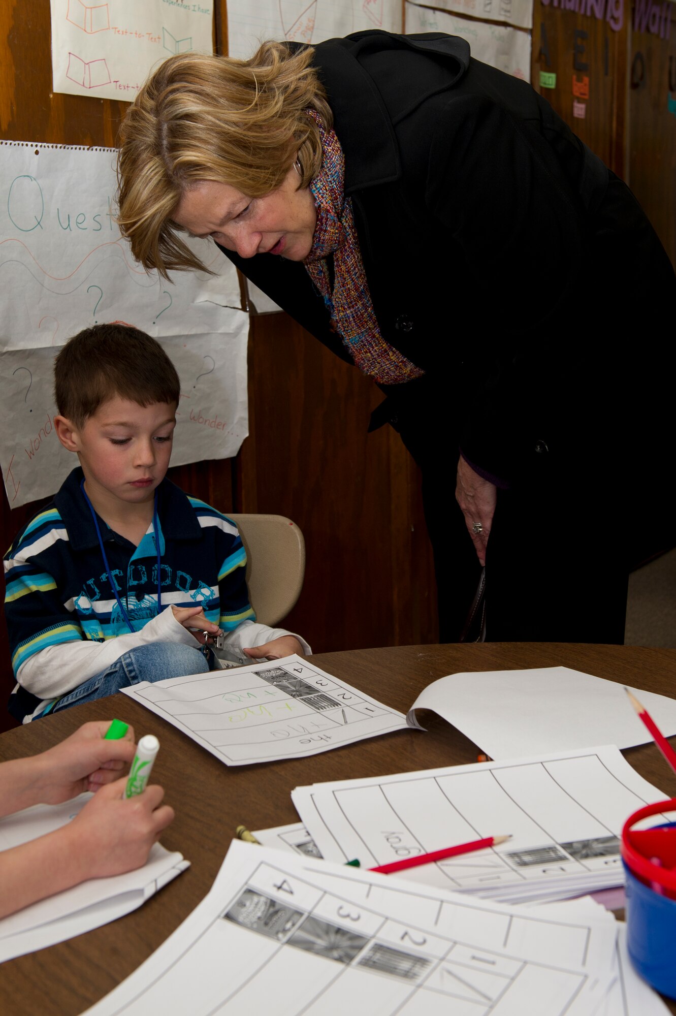 HOLLOMAN AIR FORCE BASE, N.M. -- Kim Rand, wife of U.S. Air Force Lt. Gen. Robin Rand, 12th Air Force commander, looks at a kindergartener's activity Jan. 18, during her tour of Holloman Elementary School. Rand accompanied her husband on his first trip to Holloman and visited with different base agencies. (U.S. Air Force photo by Senior Airman Kasey Close/Released)