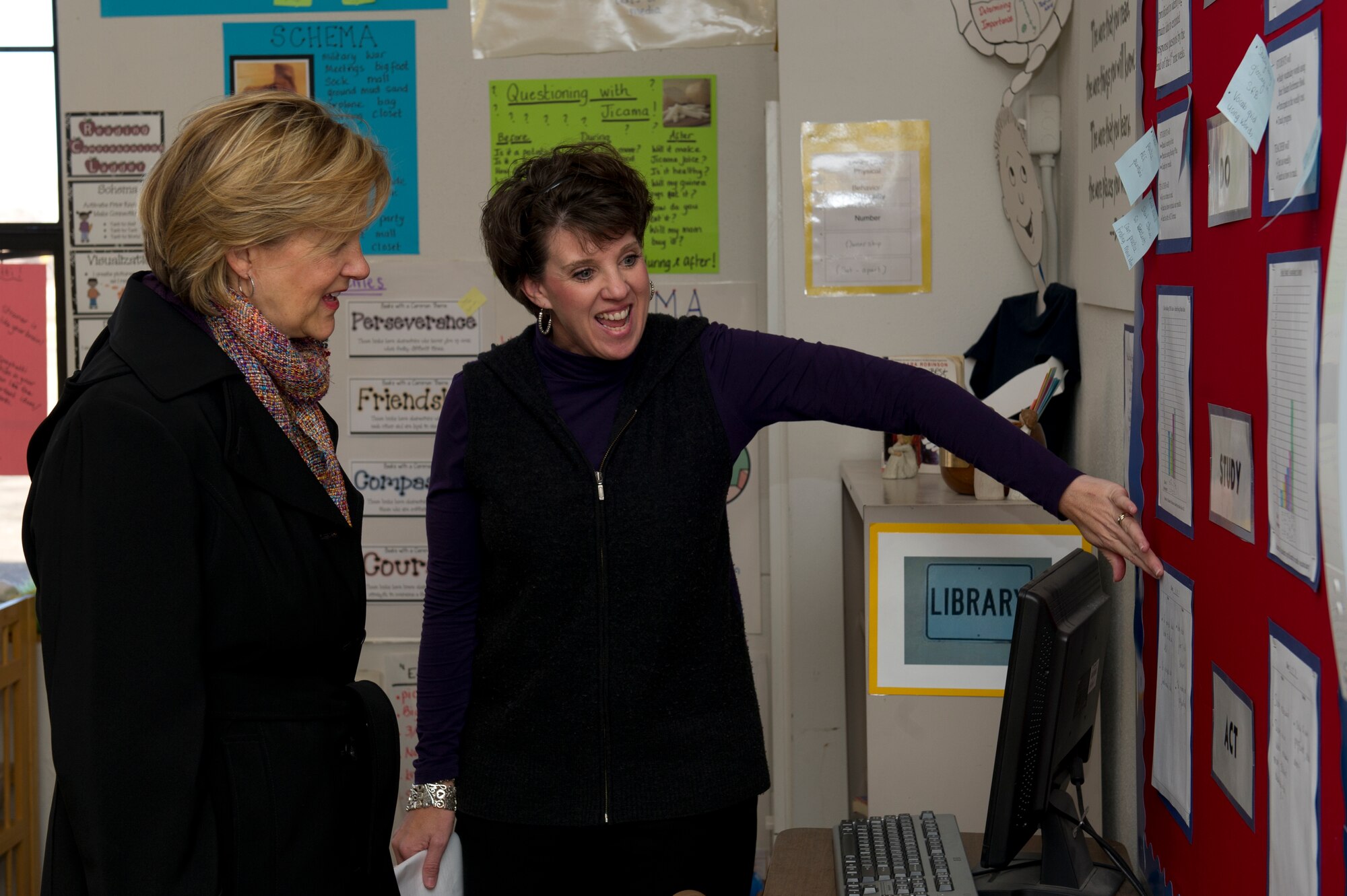HOLLOMAN AIR FORCE BASE, N.M. – Kim Rand (left), wife of U.S. Air Force Lt. Gen. Robin Rand, 12th Air Force commander, views a sheet with Michelle Korbakes (right), Holloman Elementary School principal, Jan. 18, at Holloman Elementary School. Rand accompanied her husband on his first trip to Holloman and visited with different base agencies. (U.S. Air Force photo by Senior Airman Kasey Close/Released)