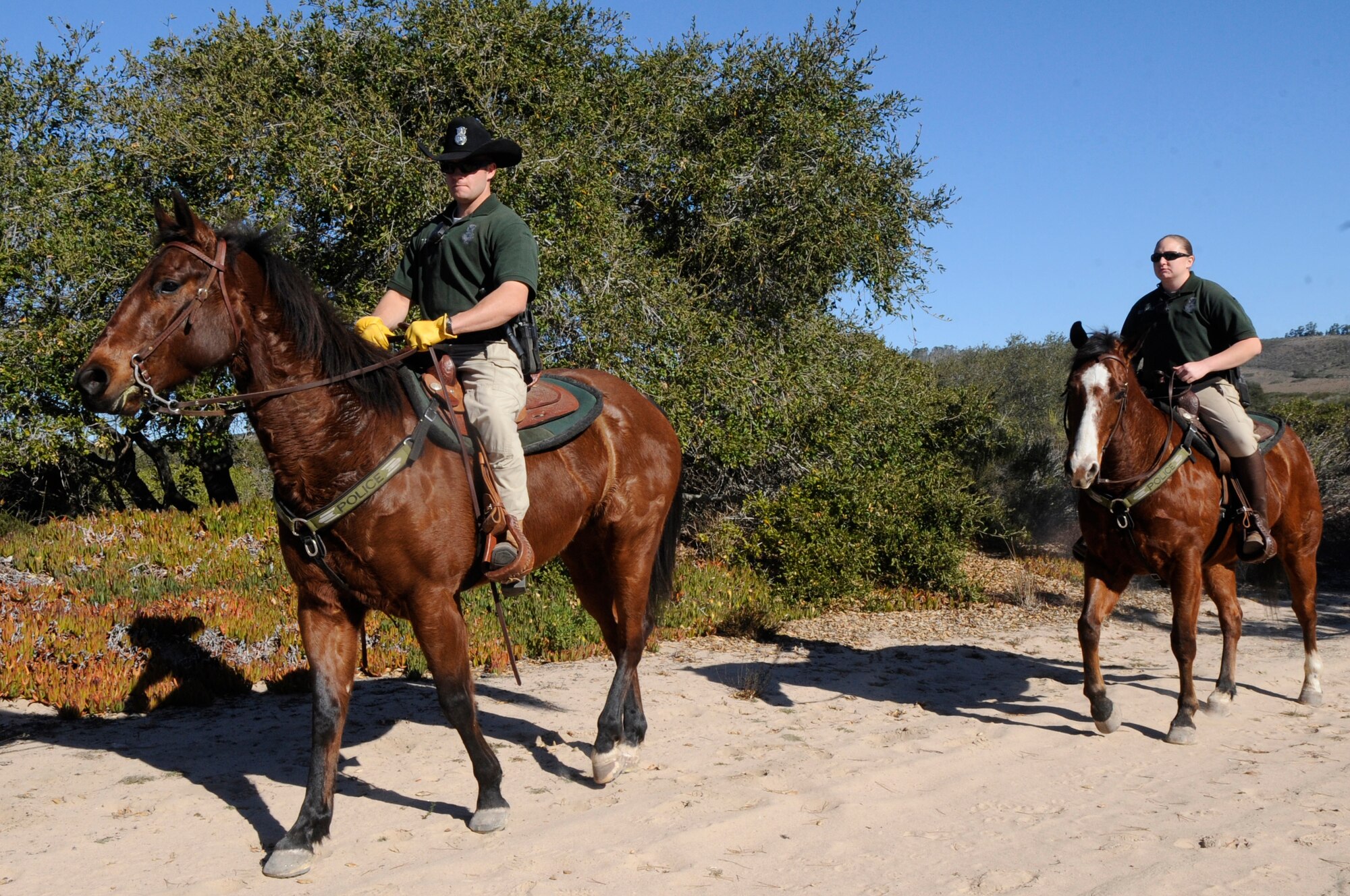VANDENBERG AIR FORCE BASE, Calif. – Staff Sgt. Cole Whitney, a 30th Security Forces Squadron conservation officer, along with Trooper, his horse, and Staff Sgt. Lauren Daniels, a 30th Security Forces Squadron conservation officer, with her horse, Scout, head out for a five-hour patrol here Friday, Jan. 13, 2012. Vandenberg’s Mounted Horse Patrol unit plays a vital role in base operations to include search and rescue operations; patrols into base territory that even all terrain vehicles cannot access; consequence management for protests; maintaining a security forces and conservation presence during hunting season; pre-launch sweeps; and beach patrols. (U.S. Air Force photo/Tech. Sgt. Scottie T. McCord)