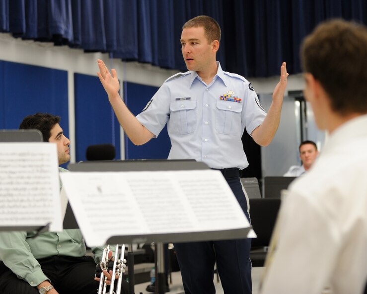 U.S. Air Force Tech. Sgt. Aaron Moats, a trombonist with the U.S. Air Force Band Ceremonial Brass Quintet and a Dayton, Ohio, native, talks to students about improving their peformance during a clinic at Palm Beach Atlantic University in West Palm Beach, Fla., Jan. 20, 2012.  The clinic involved the members of the Ceremonial Brass Quintet playing five pieces for the students, answering questions, and then working with the university's brass quintet to improve their playing style.  U.S. Air Force photo by Master Sgt. Adam M. Stump/RELEASED.