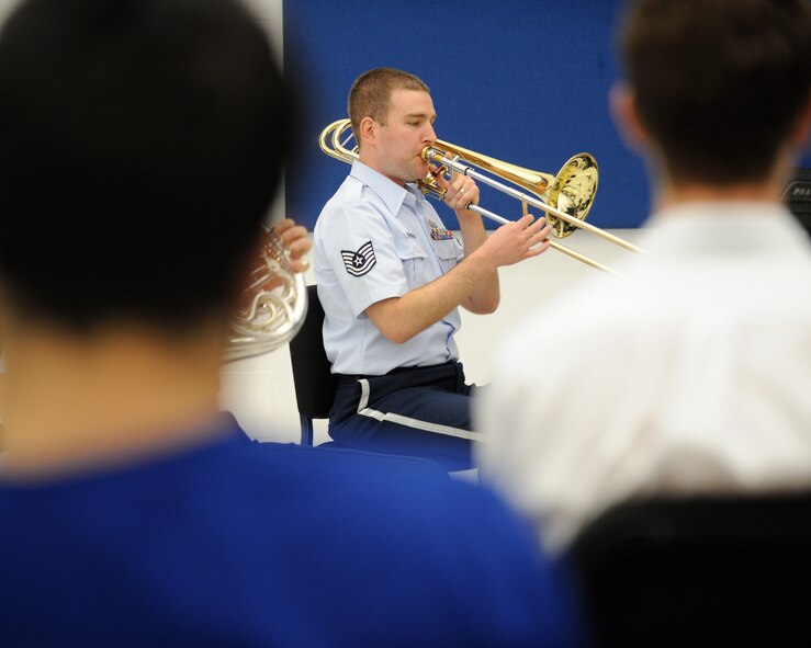U.S. Air Force Tech. Sgt. Aaron Moats, a trombonist with the U.S. Air Force Band Ceremonial Brass Quintet and a Dayton, Ohio, native, plays a piece during a clinic at Palm Beach Atlantic University in West Palm Beach, Fla., Jan. 20, 2012.  The clinic involved the members of the Ceremonial Brass Quintet playing five pieces for the students, answering questions, and then working with the university's brass quintet to improve their playing style.  U.S. Air Force photo by Master Sgt. Adam M. Stump/RELEASED.