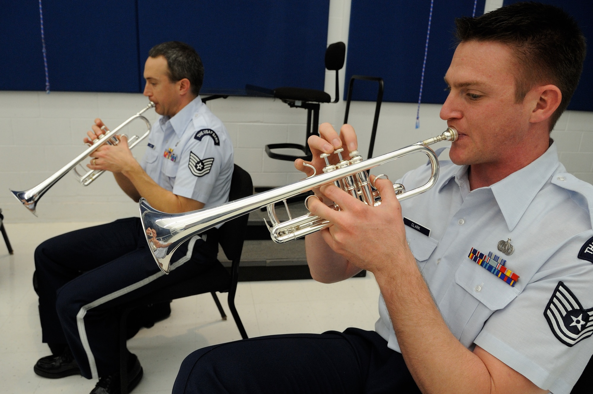U.S. Air Force Tech. Sgts. Josh Lies, left, and Nathan Clark, trumpeters with the U.S. Air Force Band Ceremonial Brass Quintet, play a piece during a clinic at Palm Beach Atlantic University in West Palm Beach, Fla., Jan. 20, 2012.  The clinic involved the members of the Ceremonial Brass Quintet playing five pieces for the students, answering questions, and then working with the university's brass quintet to improve their playing style.  U.S. Air Force photo by Master Sgt. Adam M. Stump/RELEASED.