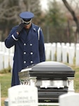 A member of the U.S. Air Force Honor Guard renders a final salute to retired Lt. Col. Luke Weathers Jr. at his burial site Jan. 20, 2012, at Arlington National Cemetery, in Virginia. Weathers’, an original Tuskegee Airman, was one of 300 Tuskegee Airmen who were awarded the Congressional Gold Medal in 2007 for their actions during World War II. (U.S. Air Force photo/Tech. Sgt. Mareshah Haynes)