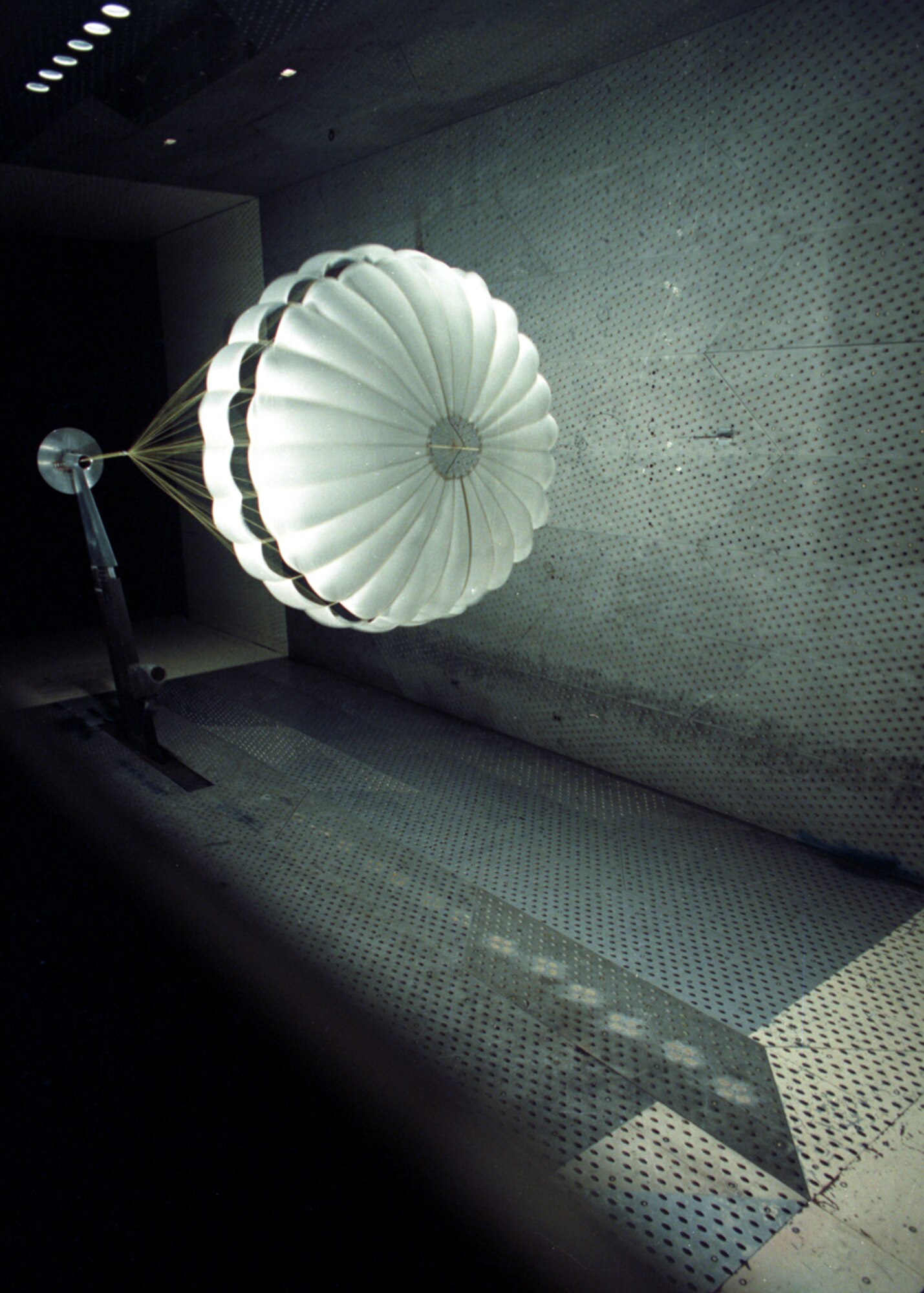 A European Space agency probe that landed on Titan, Saturn’s largest moon on Jan. 14, 2005, was tested in the 16-foot transonic wind tunnel at the Air Force’s Arnold Engineering Development Center in 1993. The mission of the Huygens probe, named after Dutch astronomer Christian Huygens who discovered Titan in 1655, was to collect atmospheric data from Titan. The probe landed by parachute. The wind tunnel model of the probe was fitted with scaled main and pilot parachutes. The chutes were opened at speeds ranging from 350 to 1,000 mph in the wind tunnel while information was gathered on their inflation characteristics. The NASA Jet Propulsion Laboratory Cassini Spacecraft carried the probe to the vicinity of Titan. The Huygens test model was designed and fabricated by Micro Craft Inc. in Tullahoma, Tenn., for the GE Aerospace Corp., which was under contract to the European Space Agency. (AEDC file photos)