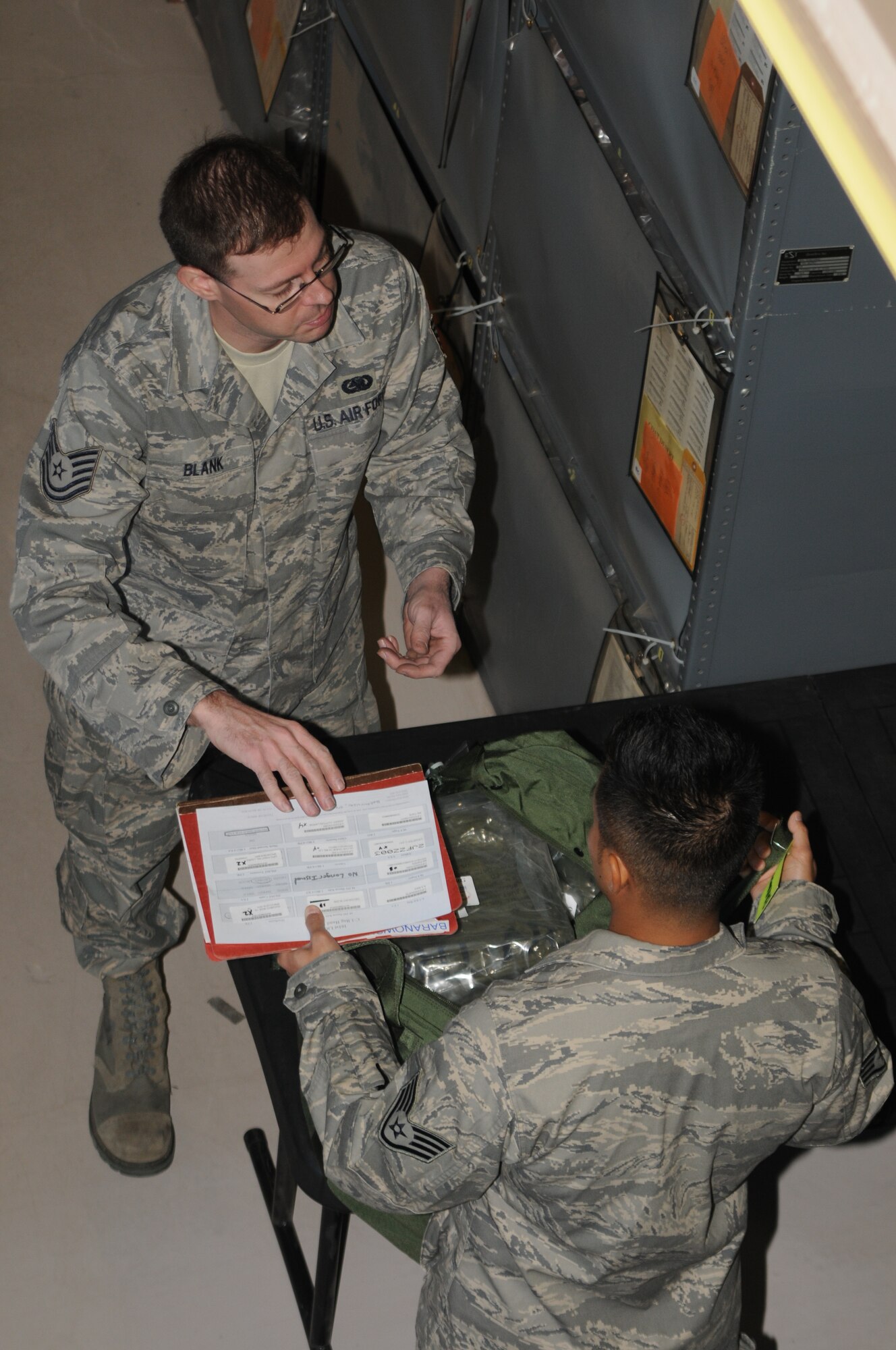PHOENIX SKY HARBOR AIR NATIONAL GUARD BASE -- Tech. Sgt. Geoffrey Blank, 161st Logistics Readiness Squadron, ensures members of the 161st Air Refueling Wing receive needed clothing and equipment during a deployment exercise here Jan. 7 and 8, 2012. The exercise enabled the wing to activate its entire deployment process. More than 130 people were required to man various deployment functions and control centers. (U.S. Air Force photo/Tech. Sgt. Susan Gladstein)