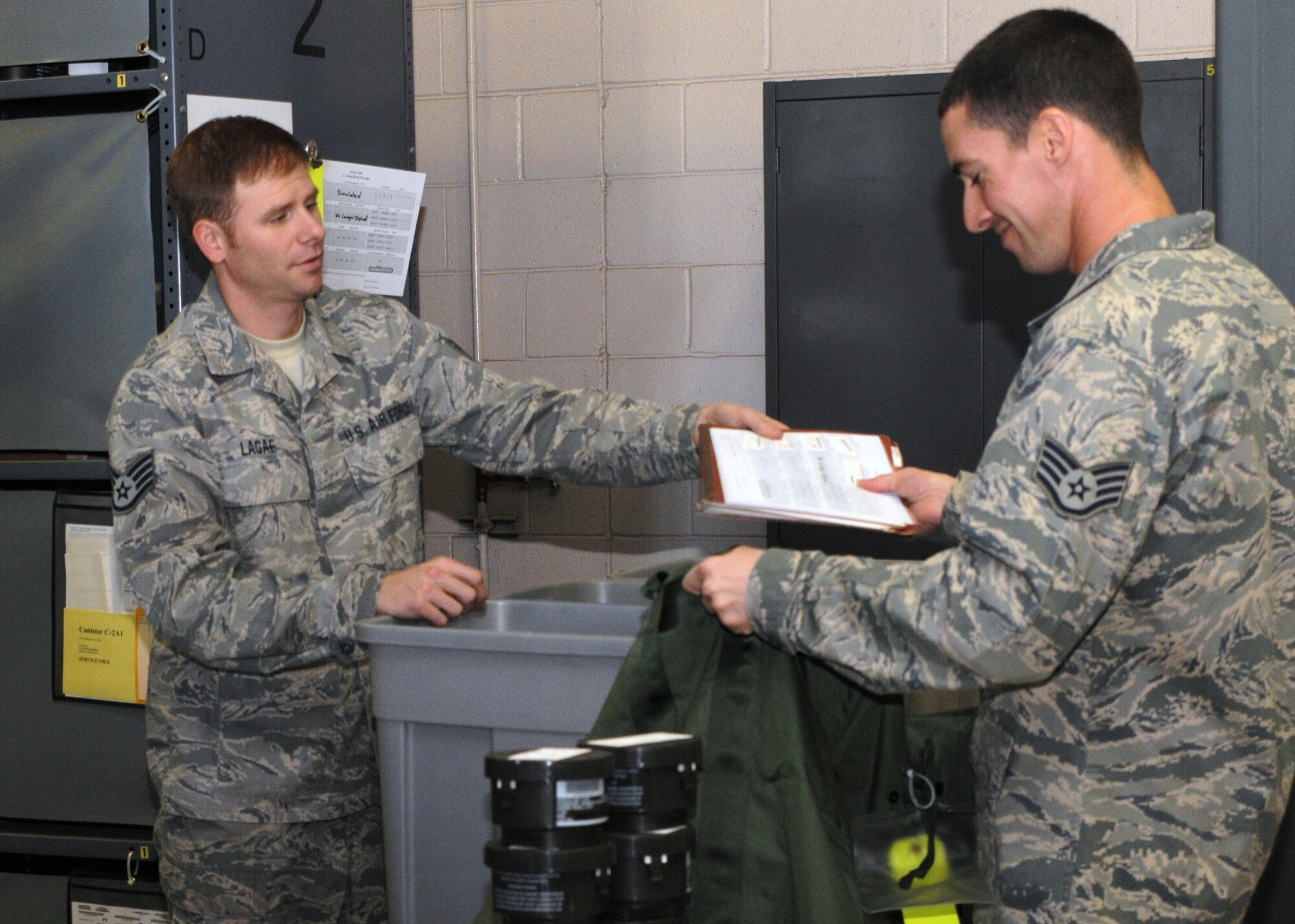 PHOENIX SKY HARBOR AIR NATIONAL GUARD BASE -- Staff Sgt. Thomas Lagae, 161st Logistics Readiness Squadron, ensures members of the 161st Air Refueling Wing receive needed clothing and equipment during a deployment exercise here Jan. 7 and 8, 2012. The exercise enabled the wing to activate its entire deployment process. More than 130 people were required to man various deployment functions and control centers. (U.S. Air Force photo/Tech. Sgt. Susan Gladstein)