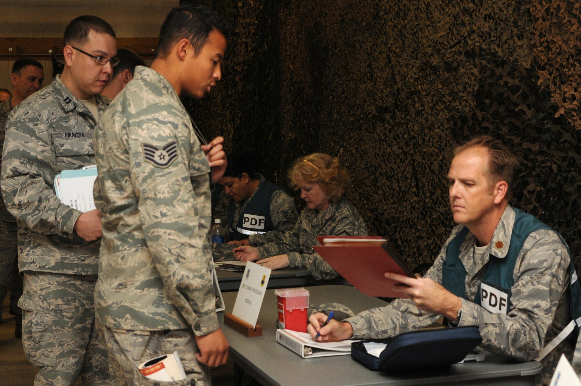 PHOENIX SKY HARBOR AIR NATIONAL GUARD BASE -- Members of the 161st Air Refueling Wing process through the medical portion during an exercise here Jan. 7 and 8, 2012. The exercise enabled the wing to activate its entire deployment process.
Forty passengers and 12 pallets of cargo were processed in about five hours. (U.S. Air Force photo/Tech. Sgt. Susan Gladstein)