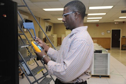 Christopher Haynes, 902nd Communications Squadron information protection supervisor, searches for unauthorized wireless networks at the 902nd Communications Squadron on Joint Base San Antonio-Randolph Jan. 18. 902nd CS is JBSA-Randolph's first line of defense against cyber attacks. (U.S. Air Force photo/Rich McFadden) (released)