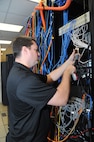 John Hipp, 902nd Communications Squadron information protection officer, checks a mainframe computer for vulnerabilities at the 902nd Communications Squadron on Joint Base San Antonio-Randolph Jan. 18. 902nd CS is JBSA-Randolph's first line of defense against cyber attacks. (U.S. Air Force photo/Rich McFadden) (released)