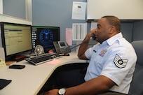 Tech. Sgt. Michael Weems, 902nd Communications Squadron client support supervisor, opens a trouble ticket for a customer at the 902nd Communications Squadron on Joint Base San Antonio-Randolph Jan. 18. 902nd CS is JBSA-Randolph's first line of defense against cyber attacks. (U.S. Air Force photo/Rich McFadden) (released)