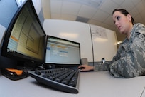 Senior Ainman Rachel Meyer, 902nd Communications Squadron client support center, opens a trouble ticket for a customer at the 902nd Communications Squadron on Joint Base San Antonio-Randolph Jan. 18. 902nd CS is JBSA-Randolph's first line of defense against cyber attacks. (U.S. Air Force photo/Rich McFadden) (released)