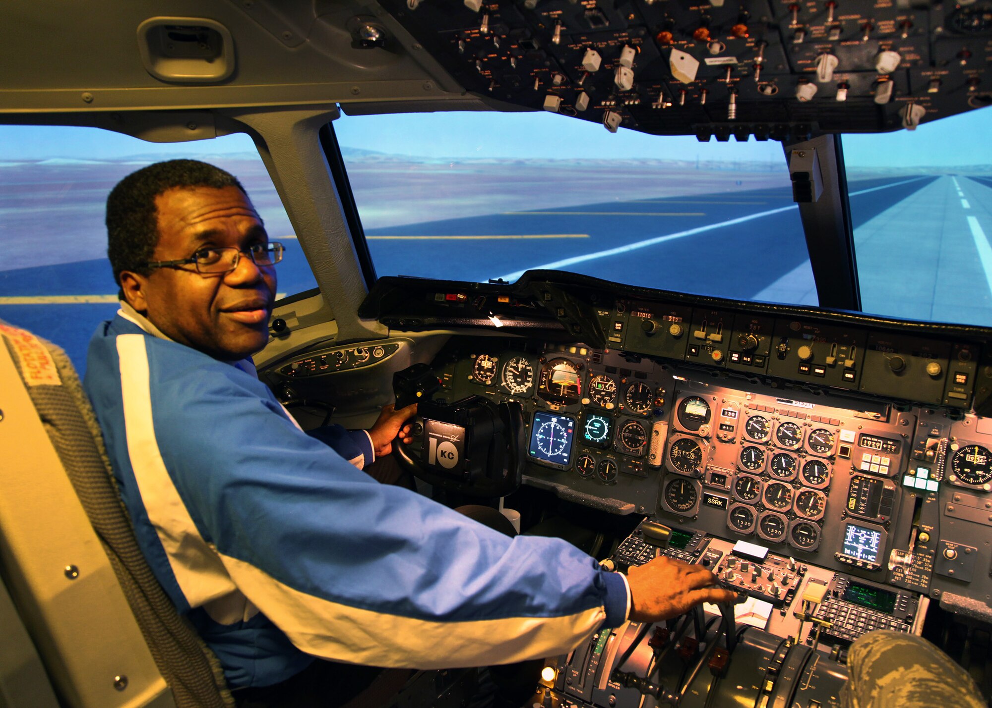 TRAVIS AIR FORCE BASE, Calif. -- Dr. Jowel C. Laguerre, Superintendent and
President of Solano Community College District, concludes his tenure as
2010/2011 349th Air Mobility Wing Honorary Commander with base tour and a
"flight" in the KC-10A Extender flight simulator, Jan. 7. (U.S. Air Force Photo / Lt. Col. Robert Couse-Baker)

