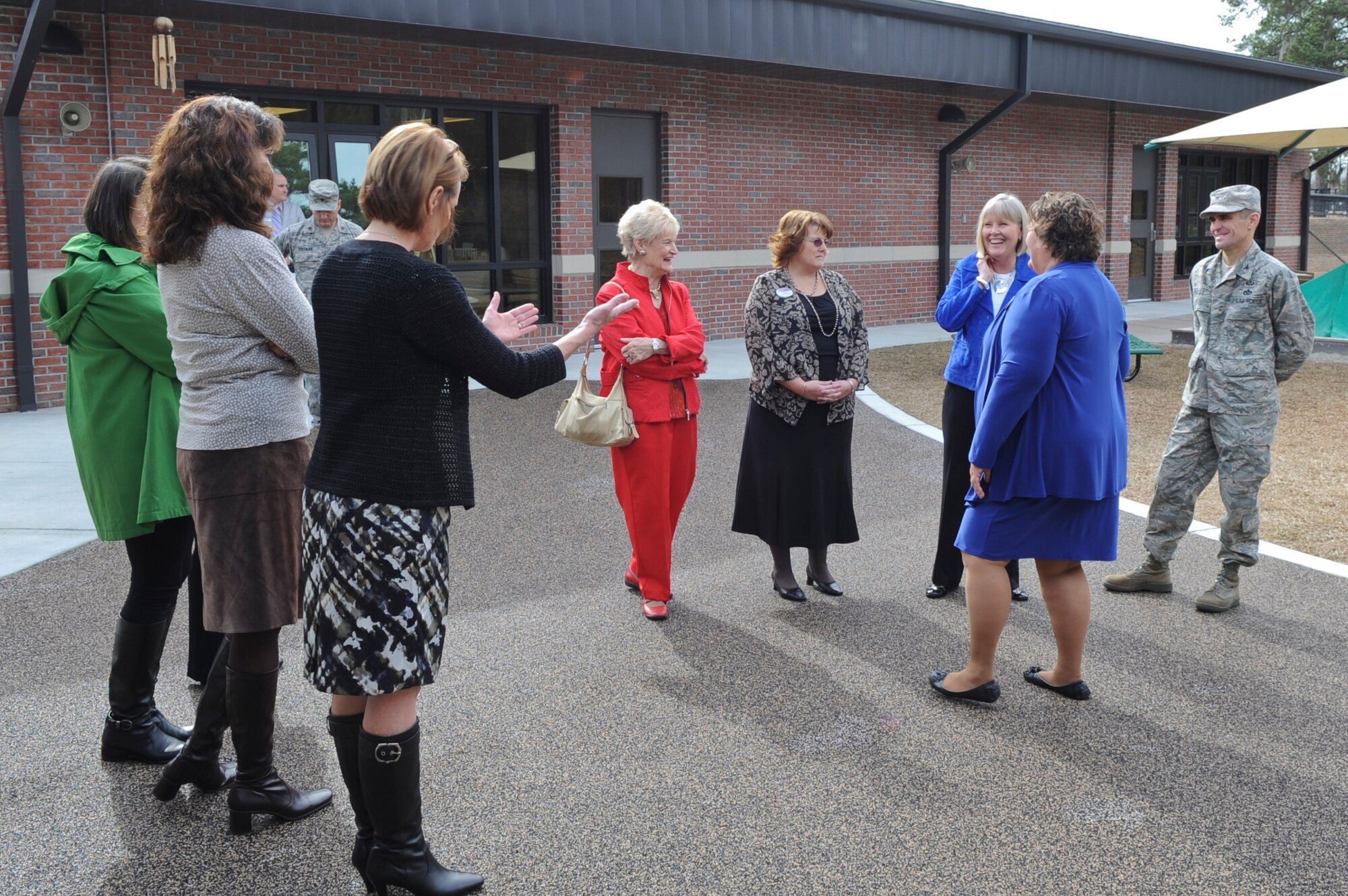 Suzie Schwartz, wife of Air Force Chief of Staff Gen. Norton Schwartz (third from right), shares a laugh with Child Development Center II staff and Moody spouses during a tour at Moody Air Force Base, Ga., Jan. 18, 2012. Schwartz toured the newly built CDC II to view its programs for the children of Moody. (U.S. Air Force photo by Airman 1st Class Olivia Dominique/Released)