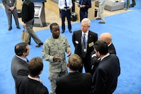 Gen. Edward A. Rice Jr., Air Education Training Command commander visits with  vendors who represent companies in the aerospace industry during the Air Education Training Command 2012 Symposium at the Henry B. Gonzalez Convention Center, San Antonio, Texas.  ( U.S. Air Force photo by Don Lindsey)
