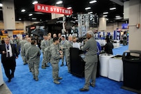 Visitors look at several of the vendor displays during the Air Education Training Command 2012 Symposium  held at the San Antonio Convention Center Jan. 12 - 13. (U.S. Air Force photo by Don. Lindsey)