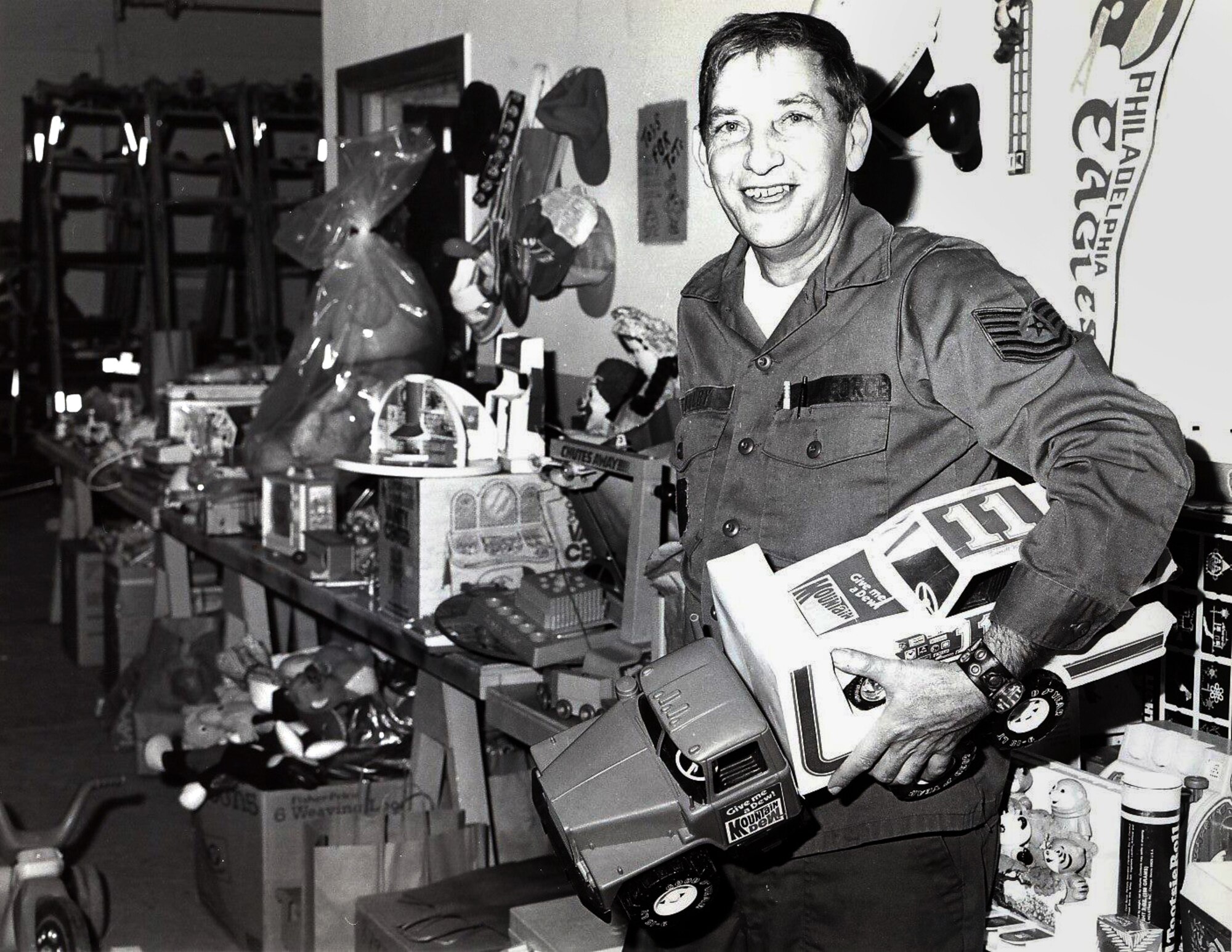 Historical photo of Tech. Sgt. William G. Willey delivering donated toys during one of the 177th Toys for Tots drives. The annual Willey award was created by the 177th Chief's Council to honor his memory by selecting a Senior Non-Commissioned Officer that demonstrated the same qualities Willey exemplified.  (U.S. Air Force photo by Master Sgt. Terry Young, 177th Fighter Interceptor Group Visual Information)