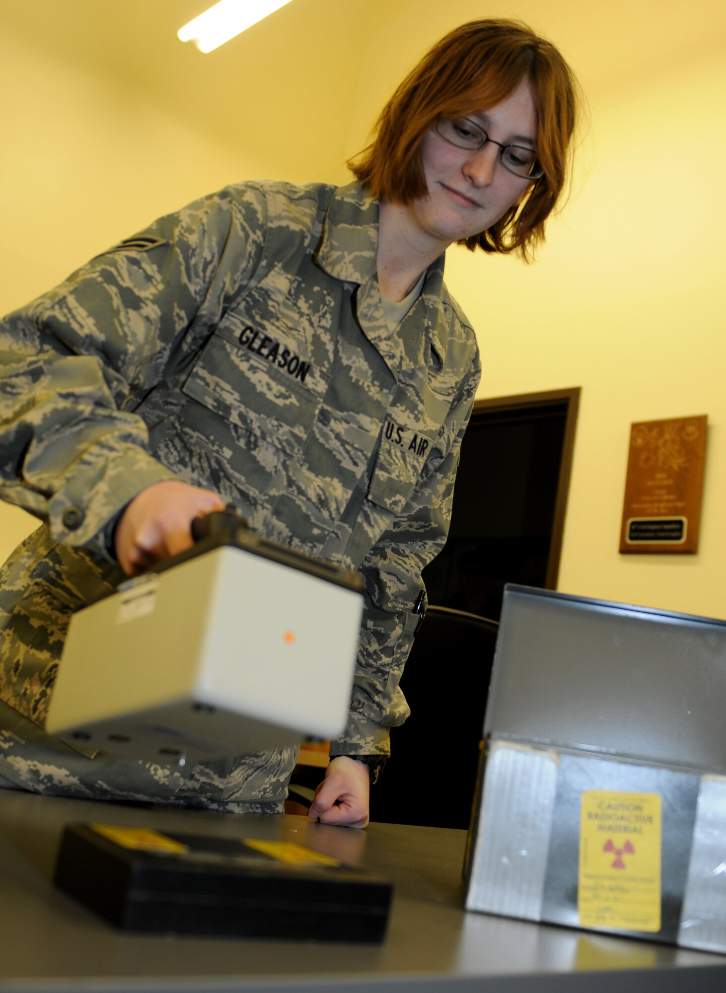 ROYAL AIR FORCE LAKENHEATH, England -- Airman 1st Class Lea Gleason, 48th Civil Engineer Squadron emergency management apprentice, checks equipment, jan. 20, 2012. Gleason was nominated for a Liberty Spotlight because she displays the core value of 'Excellence in All We Do'. (U.S. Air Force photo by Airman 1st Class Cory Payne)