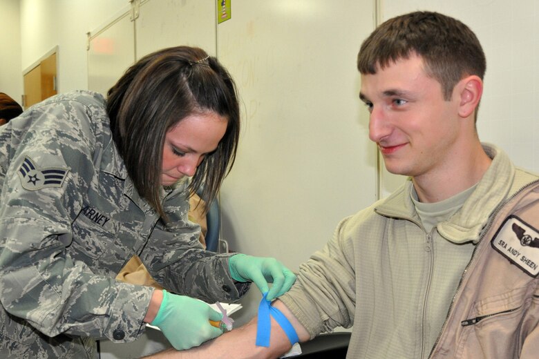 YOUNGSTOWN AIR RESERVE STATION, Ohio— Air Force Reserve Senior Airman Denise A. Arney, a Medical and Laboratory Technician with the 910th Medical Squadron, draws blood for a post-deployment HIV test here Jan. 19 from Senior Airman Donald A. Sheen II, a loadmaster with the 773rd Airlift Squadron. Pre and post deployment HIV tests are required for all Airmen as well as every two years while serving in the Air Force.  Airman Sheen was one of approximately 40 Citizen Airmen who returned home after a 120-day deployment to Southwest Asia in support of Operation Enduring Freedom. U.S. Air Force photo by Maj. Brent J. Davis